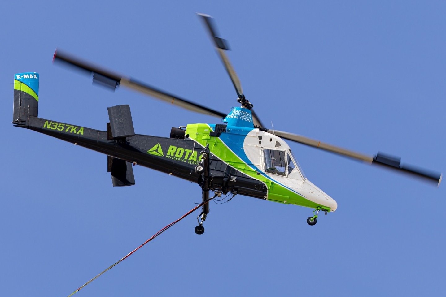 A very unique Rotak Helicopter Services Kaman K-1200 KMAX N357KA doing water bucket drops fighting a wildland fire in East Wenatchee, WA in support of ground crews.