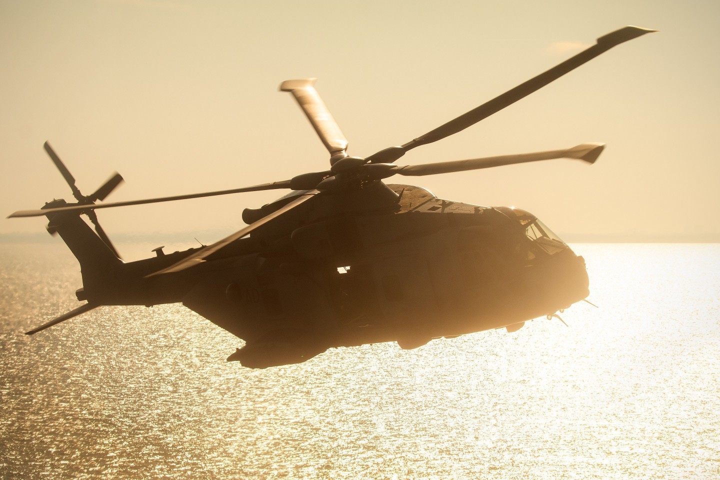 A Merlin of 846NAS turns towards the target location during an anti-terrorism training mission over the North Sea, with Dutch special forces operators about to perform a simulated hostage rescue on board of a Dutch Coast Guard vessel. Photo is shot from another Merlin which is providing top cover for the operation, together with a Dutch police AW139.