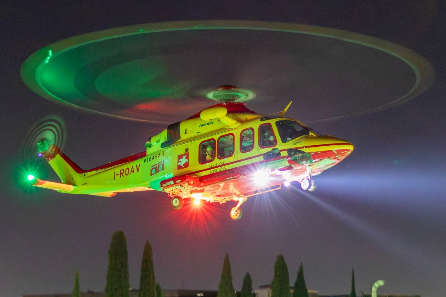 Tuscanian HEMS helicopter I-ROAV (known as PEGASO 2) taking off from Careggi hospital in Florence.