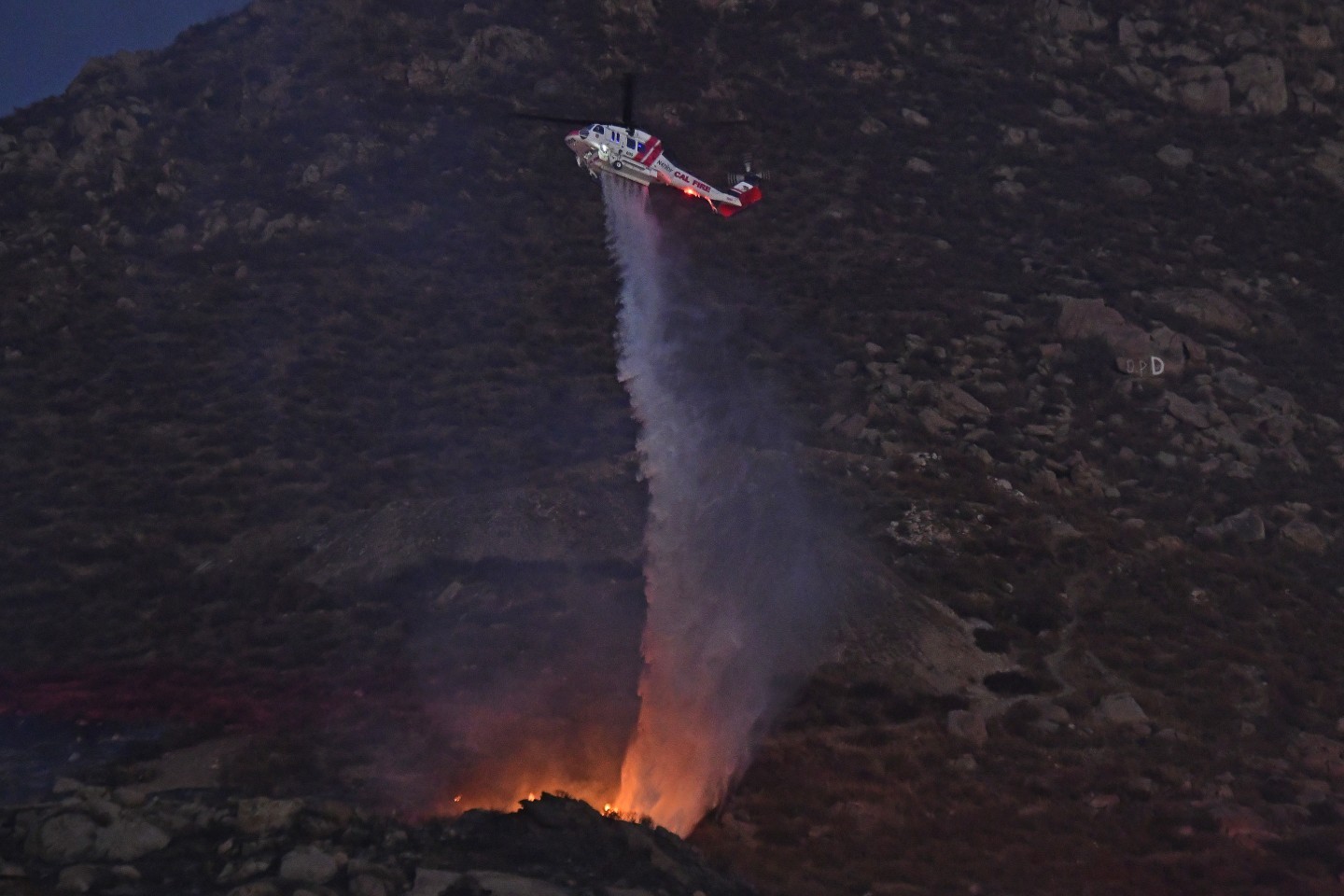CalFire's S-70i Copter 605 makes a direct hit on a flare up on the Gibble Fire.