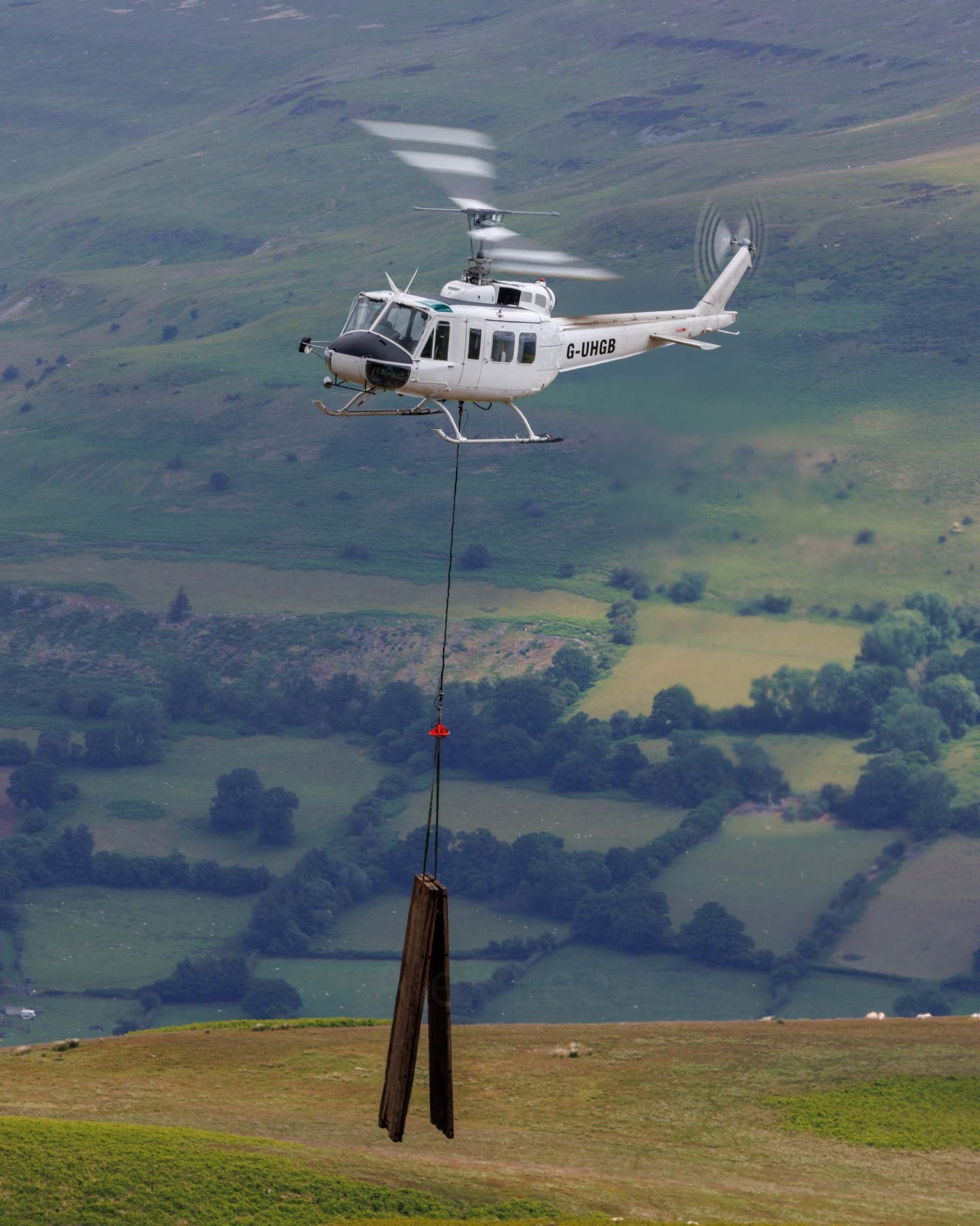 G-UHGB of Heli-Lift services at Llangynidr moors, Wales.
The aircraft was tasked with carrying equipment onto the moor to be used to fix a gas pipeline