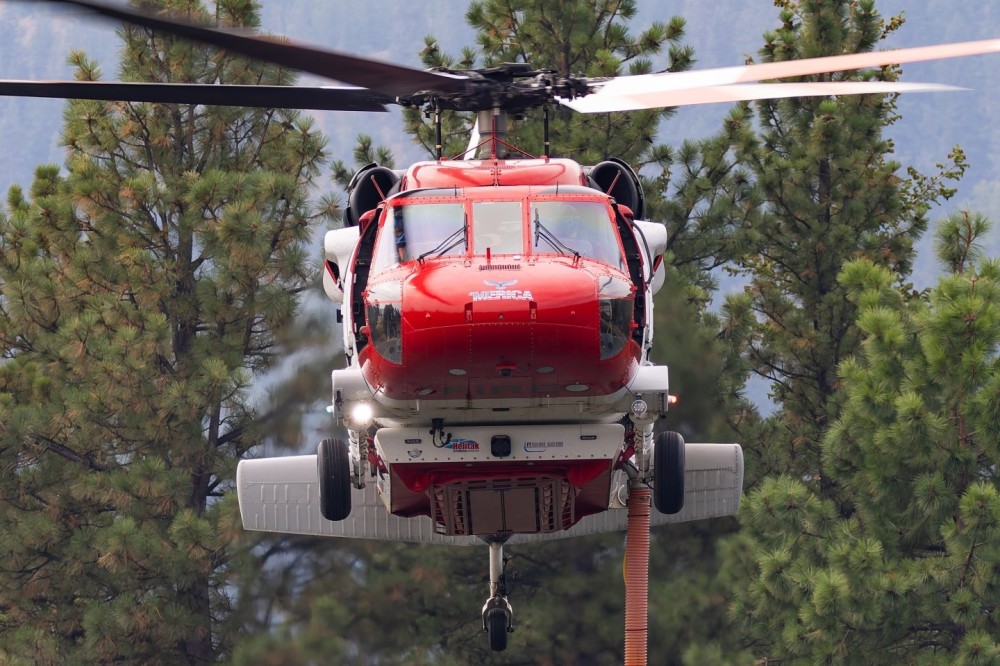 Northwest Helicopters N660NW Blackhawk dubbed 'Merica setting down to draft weater from Beehive Reservoir on Mission Ridge in support of the Mission Ridge Fire.