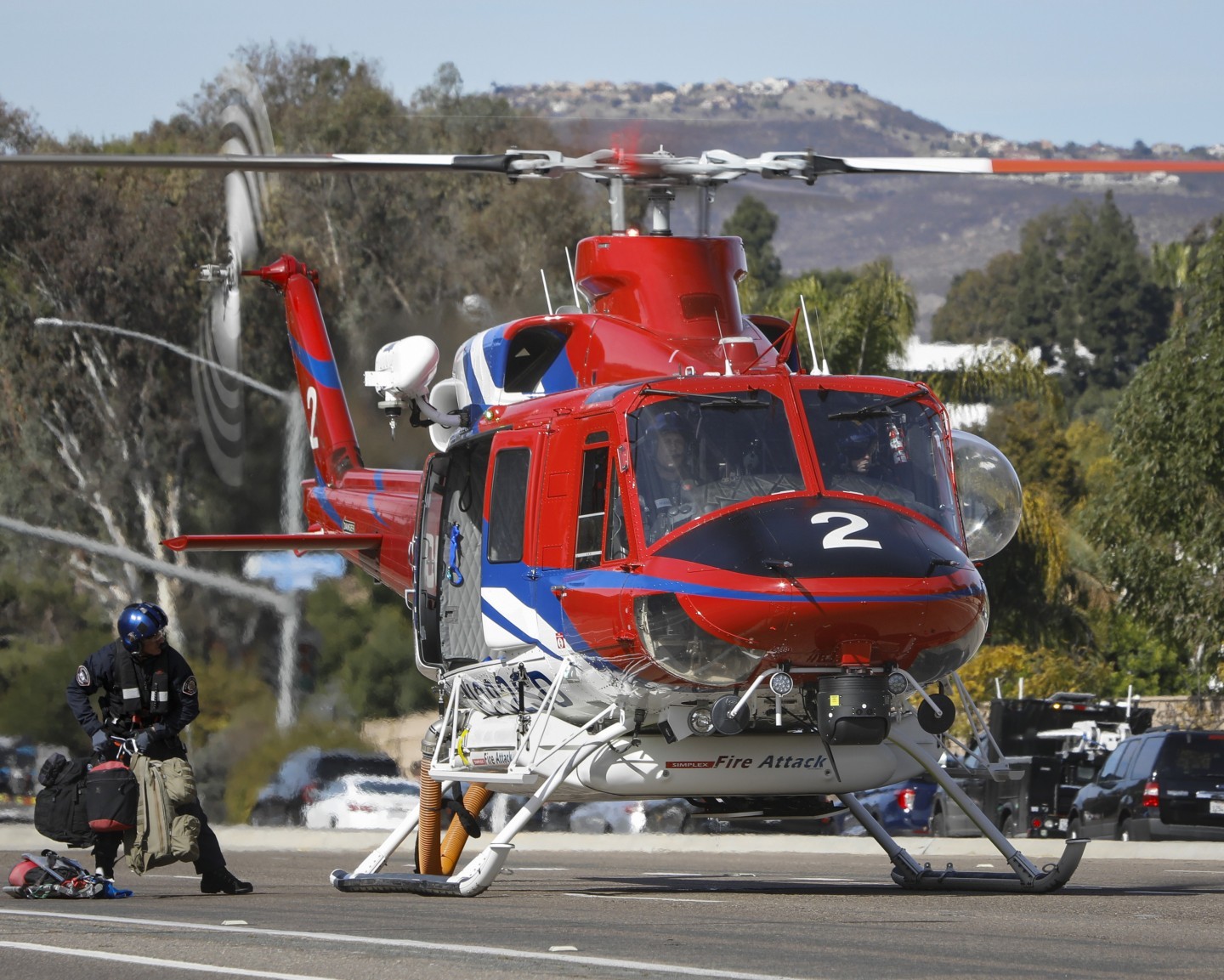 San Diego Fire-Rescue Air Ops Copter 2, lands in the city streets of Rancho Bernardo, CA to pickup their medic/crew chief after battling the Center Fire in January 2025.