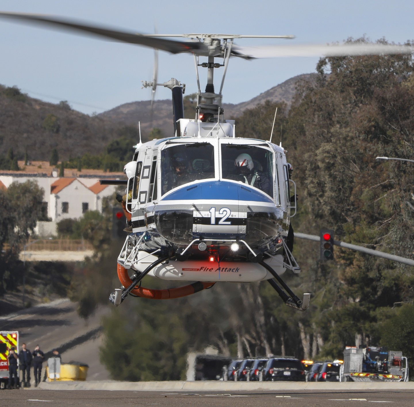 San Diego County Sheriff Department's Copter 12, leaves Rancho Bernardo, CA after picking up the Gillespie helitack crew during the Center Fire in January 2025.
