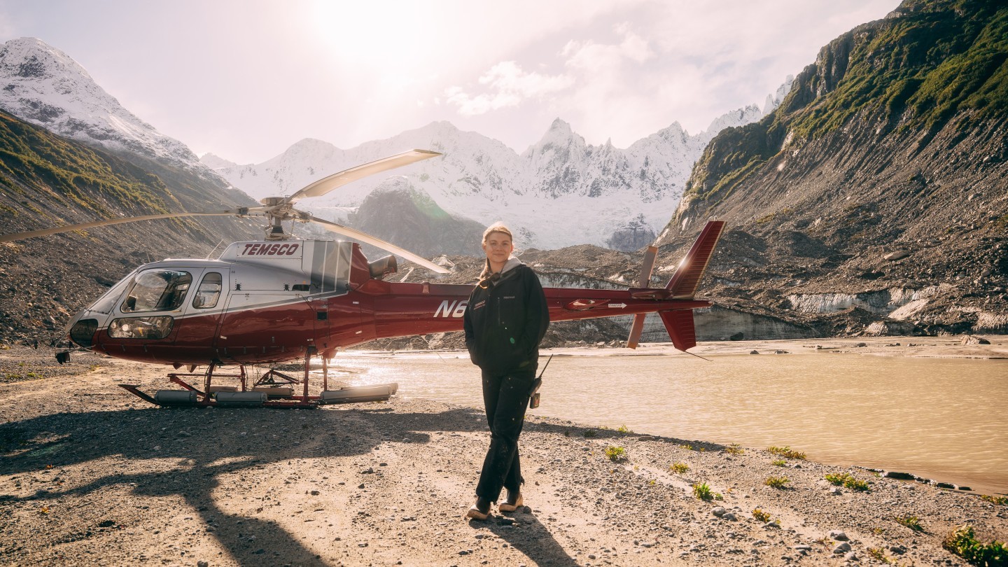 This is a shot of Sitara More, a pilot for TEMSCO Helicopters in Alaska. She stands next to her Astar on the last day of flying for the 2025 summer season. We took a group out to an area we call the "Grand Canyon" in the Chilkat Mountains outside of Skagway, AK.