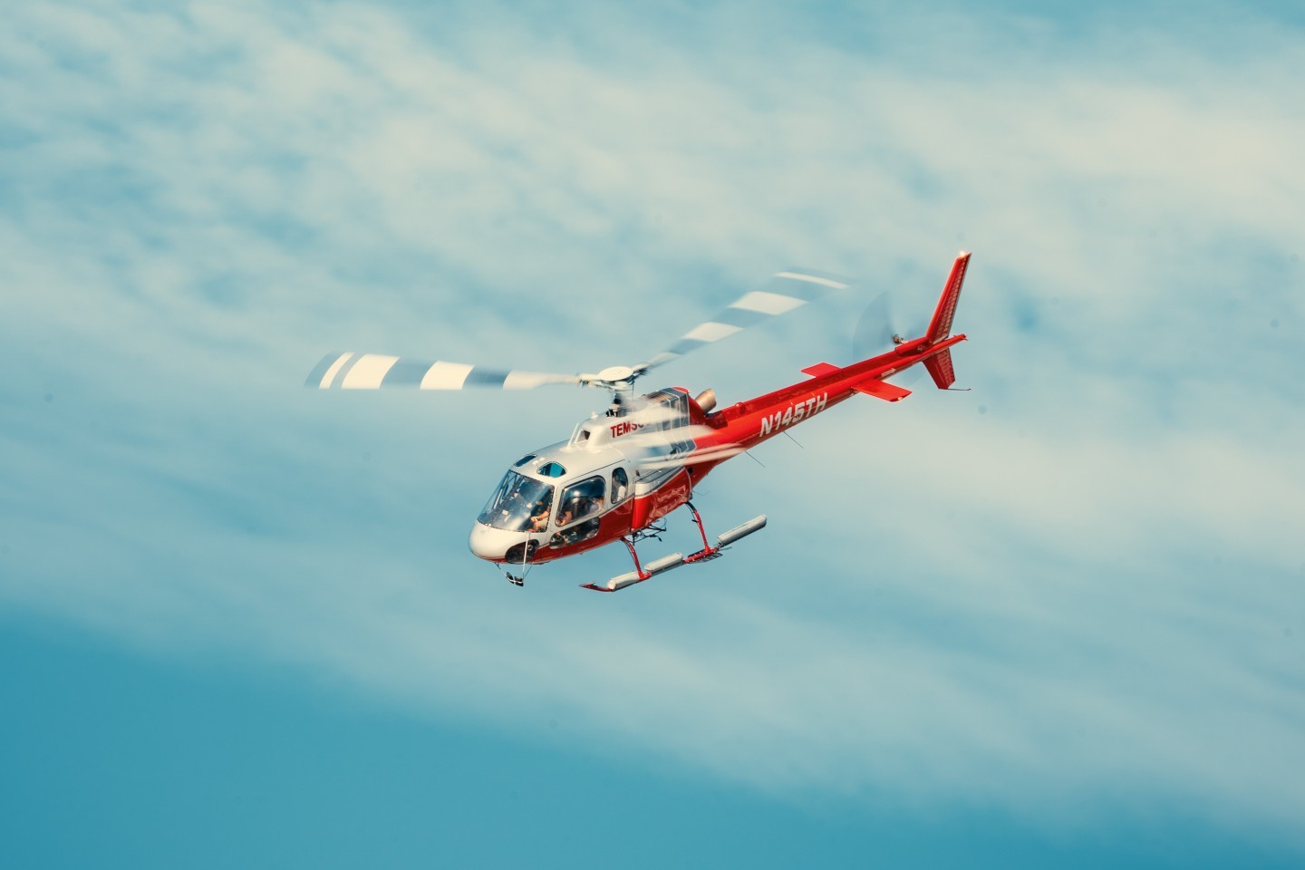 An AS350 turning back into the Skagway base after bringing a group of people to their glacier excursion.