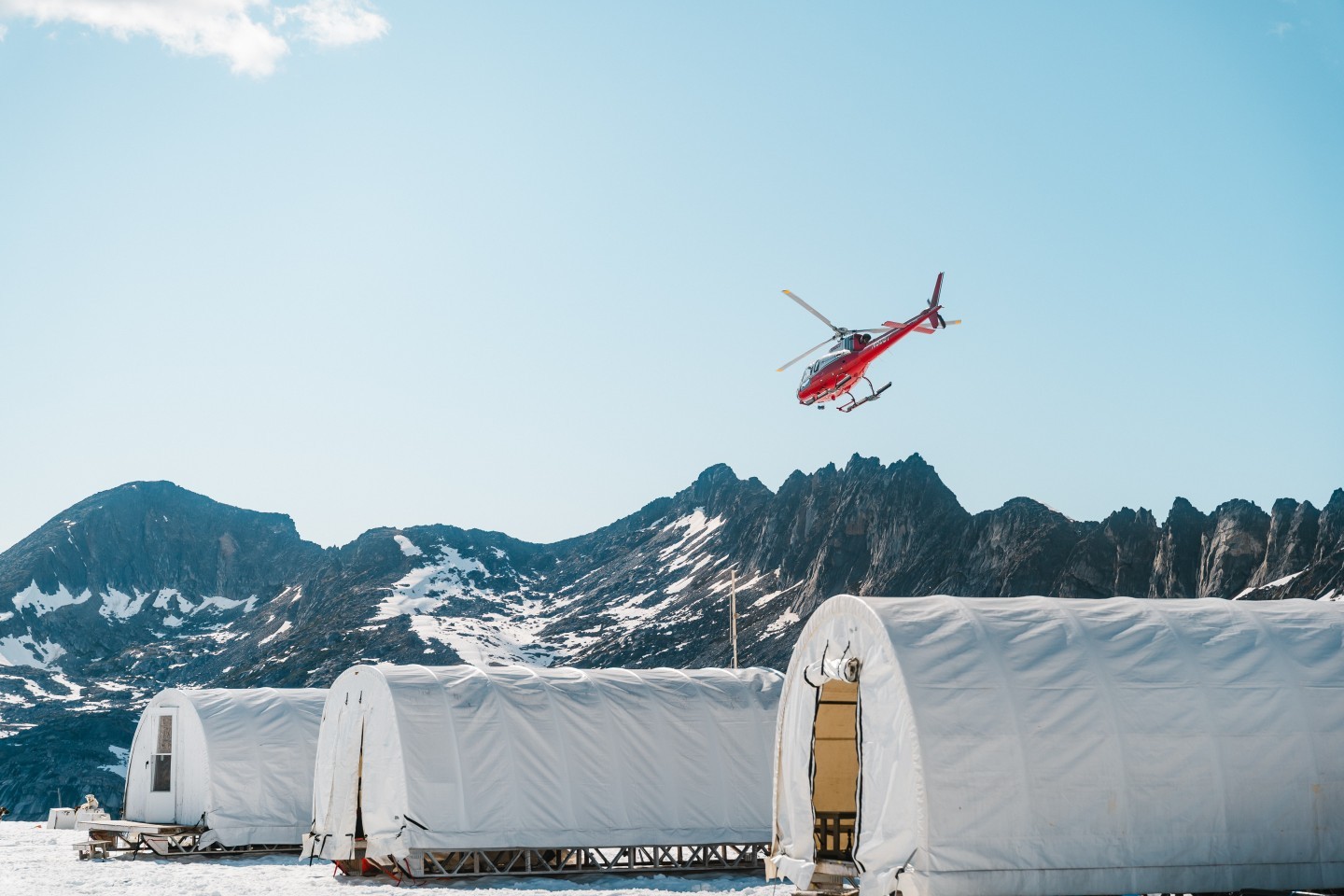 Departing from the Denver glacier. Also shown are a few of the sled dog camp crew quarters (tents).