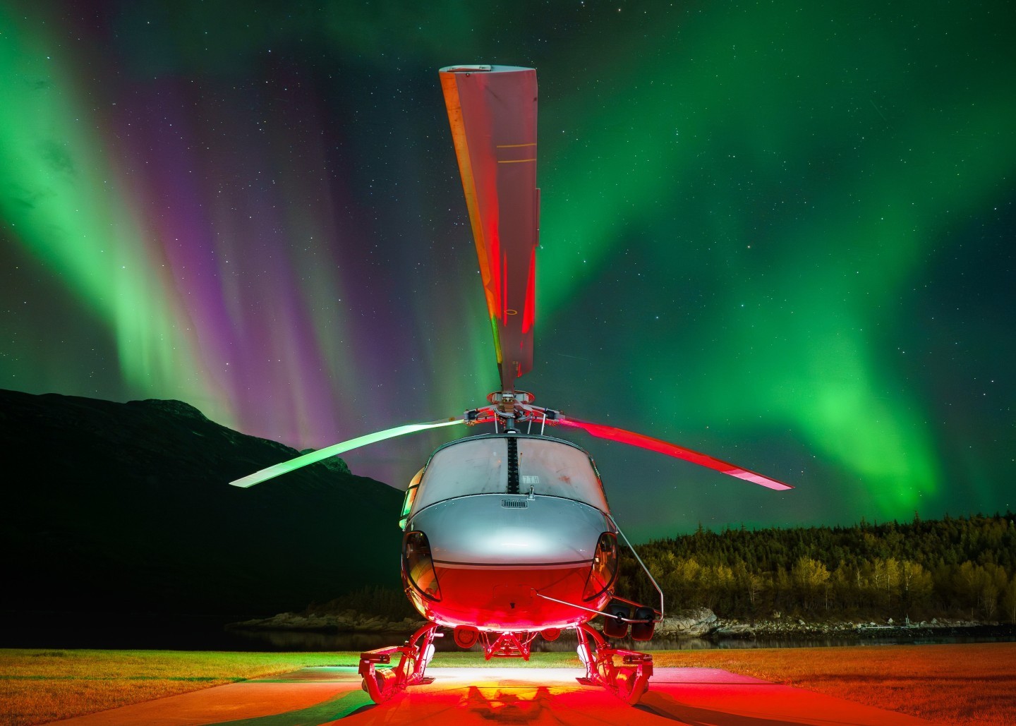 Some of my favorite shots of the year. Finally at the end of the summer season, we had a few clear nights with high KPI. Very excited to catch the light dancing behind the Astar. These helicopters work hard during the summer, they deserve to rest and enjoy the light show.