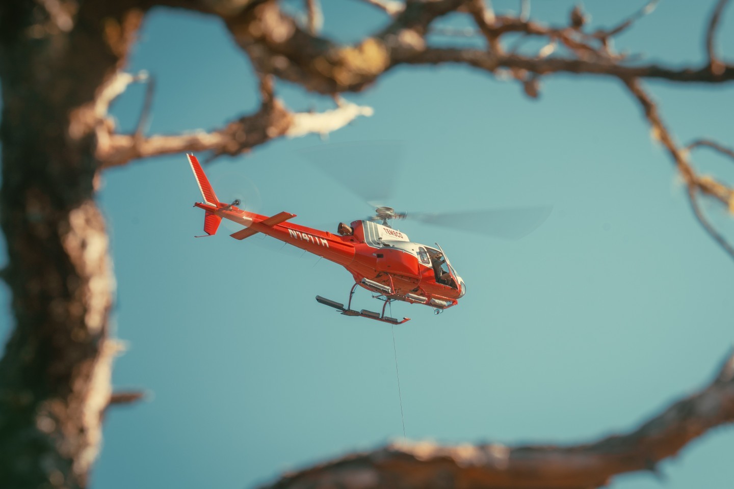 New pilots learning to sling in the left hand drive astar. Instructor pilot in the right seat with dual controls is able to take over if things get a little western. After a few flights, the instructor will be on the ground acting as ground crew for the new sling pilot.