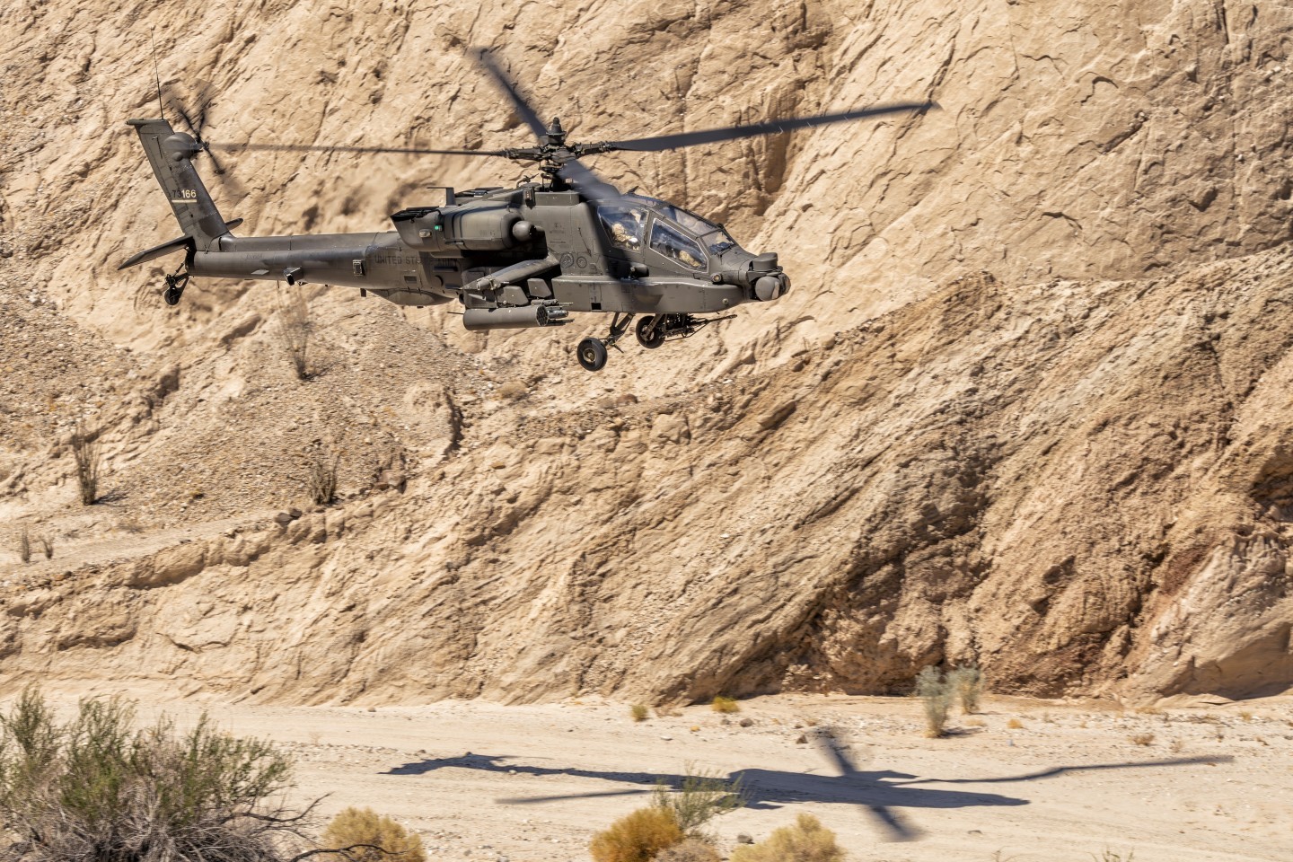 I got an amazing opportunity to photograph Army AH-4 Apache Attack helicopters from the 4th Battalion, 6th Cavalry flying through a desert canyon in Anza-Borrego Desert State Park near the town of Borrego Springs, California. Fortunately, I was able to drive a sandy dirt road to the location and climb a very slippery, but short hill, because the hike in 106° weather would have been quite difficult. Because the Apache was flying so low, I was able to include the shadow on the ground.