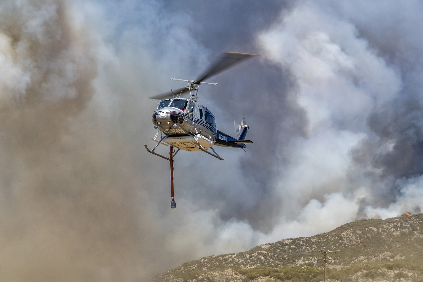 Ramona Helitack 205 lifts off after dropping its crew off to fight the Rosa Fire near Mountain Center, California. The intense smoke from the fire made a really dynamic background.