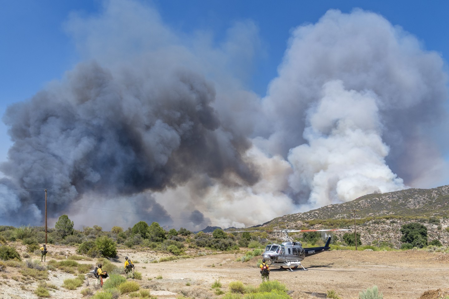 Ramona Helitack 205 lifts drops its crew off  its crew off to fight the Rosa Fire near Mountain Center, California. The road where the fire was encroaching, was just a few 100 feet to the left. I was unable to drive on that road because of how dangerous it was.