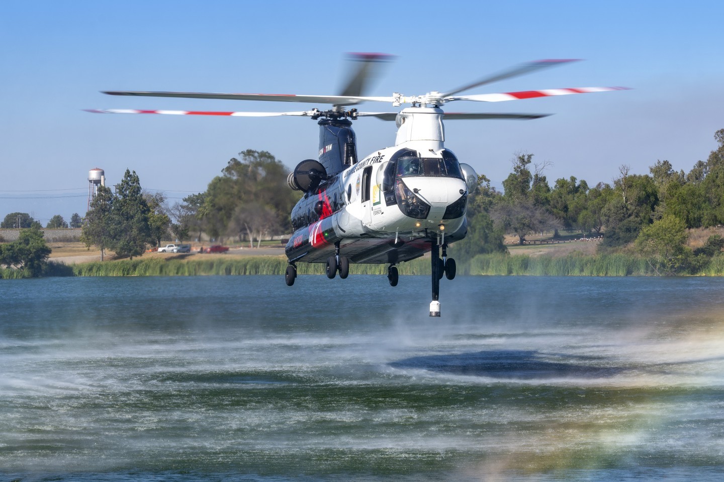 Coulson's Orange County Fire Authority Chinook gets ready to pick up water at Prado Regional Park to drop at the Euclid Fire in Chino Hills, California. Being this close to the Chinook and watching this highly trained pilots is really exhilarating.  I'm grateful to be able to document these images.