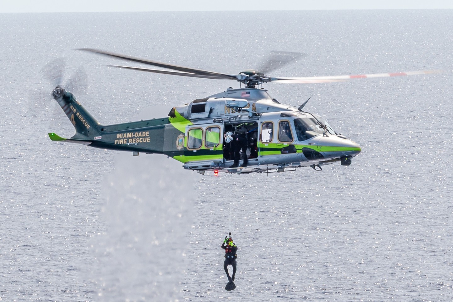 Miami Dade Fire Rescue's Air Rescue 4 is pictured here near Government cut  in Miami Beach Florida,  conducting rescue diver training.