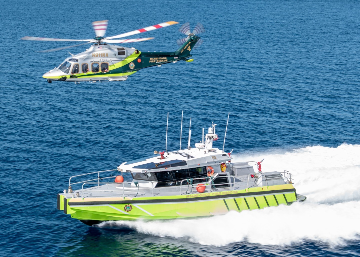 Miami Dade Fire Rescue's Air Rescue 4 posing here with a Metal Shark 55ft Miami Dade Fire Rescue Rescue boat during a photoshoot/training operations near Miami Beach