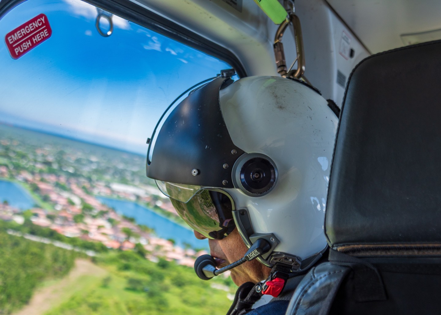 A Miami Dade Fire Rescue paramedic/firefighter keeps a watchful eye on a rapidly developing brush fire near Miami Excecutive Airport.