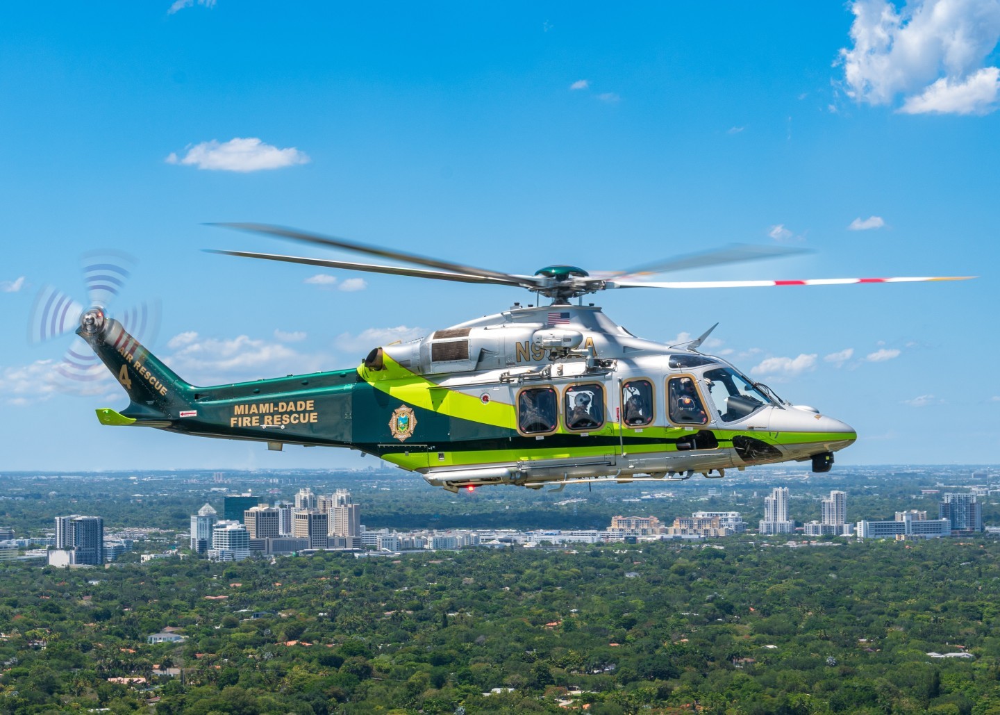 Miami Dade Fire Rescue Air Rescue 4 posing with its crew during a familiarization flight over Coral Gables Florida.