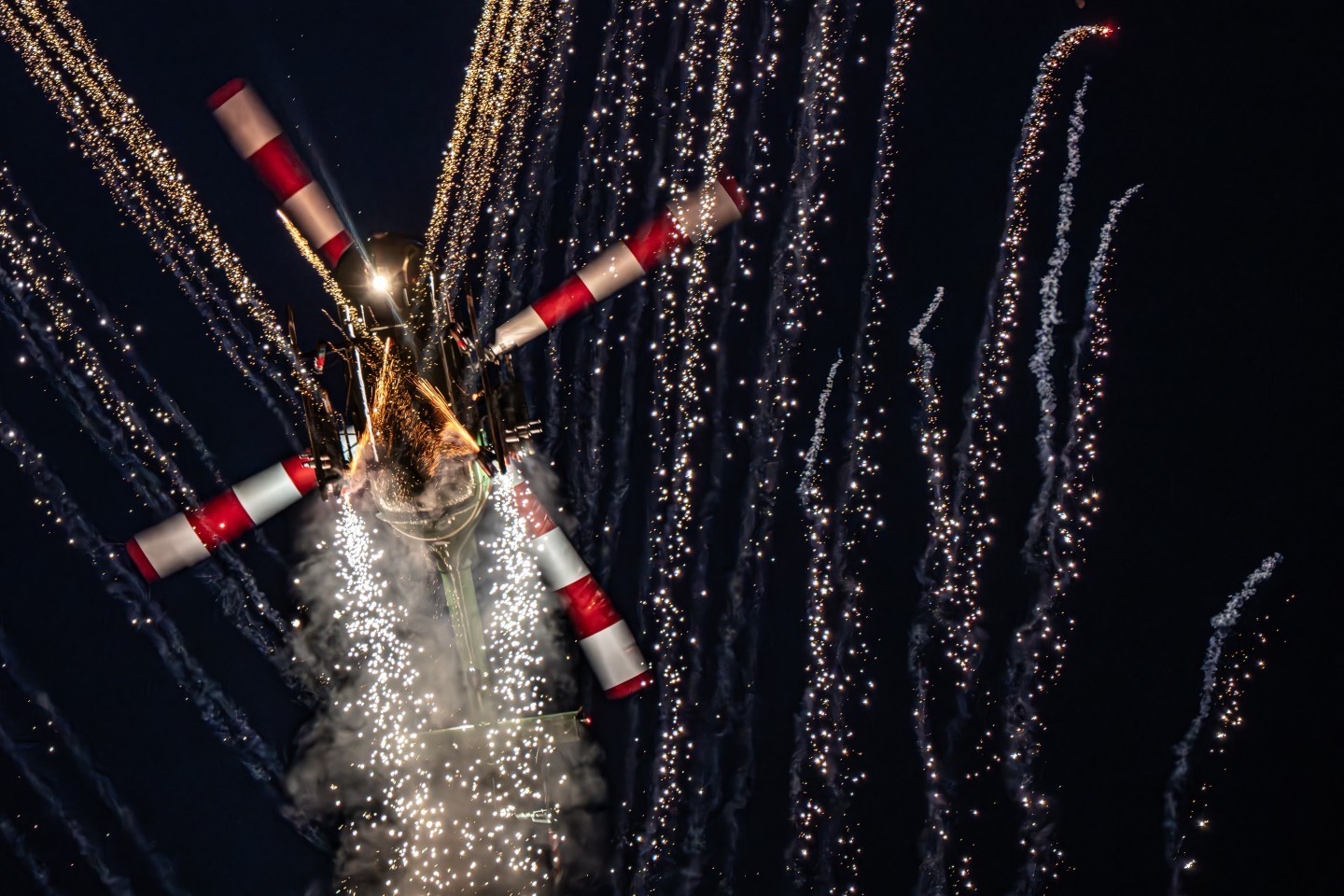 The photo was taken at the Sanicole Sunset Airshow 2025 in Belgium, capturing the Polish Bölkow Bo-105 helicopter flown by veteran pilot Maciej Dominiak. Once a German Army attack helicopter, now reborn as a spectacular airshow performer, the Bo-105 shows breathtaking agility and precision. During the display, it lights up the evening sky with fireworks, blending technical mastery, pilot skill, and pure visual drama.