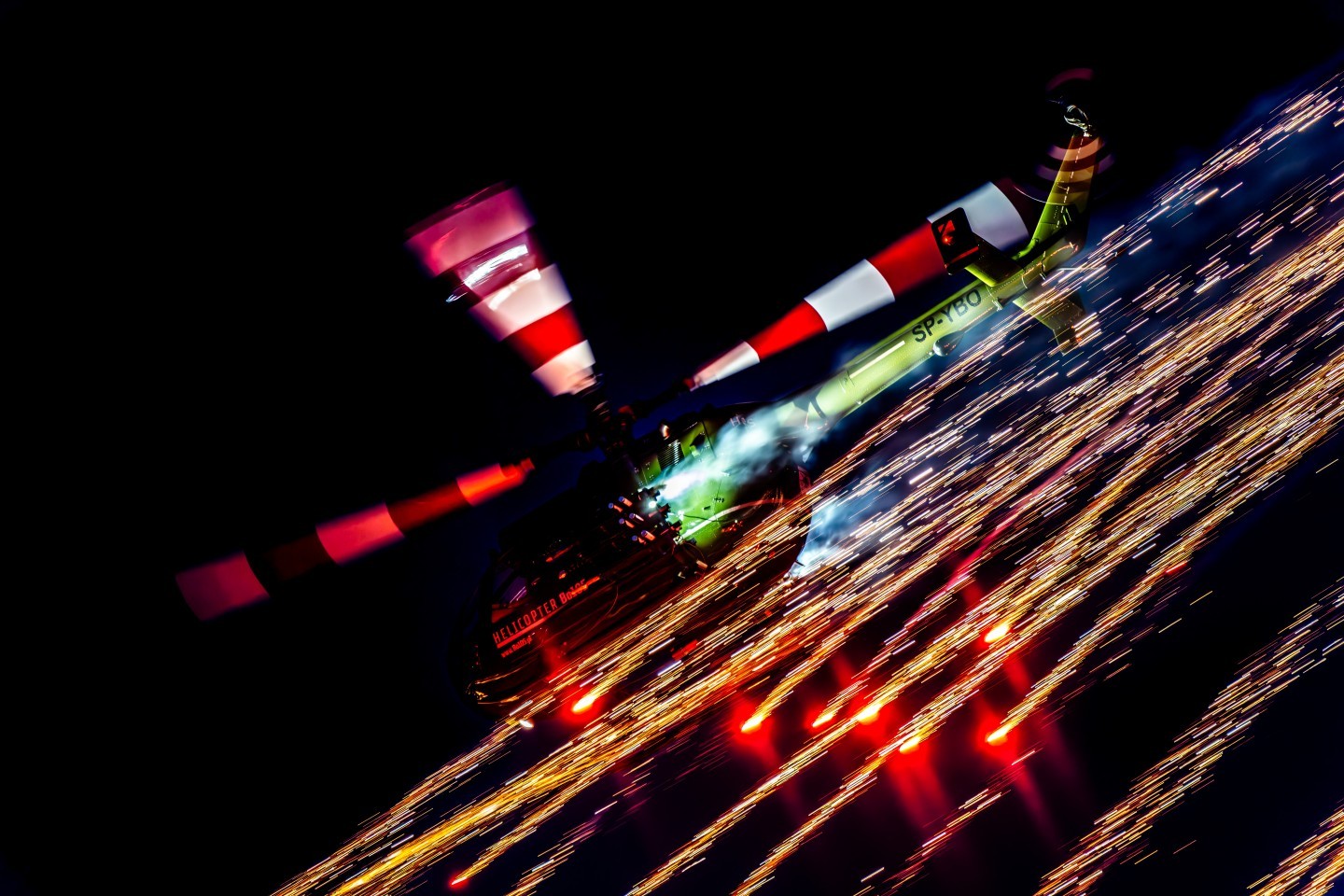 The photo was taken at the Sanicole Sunset Airshow 2025 in Belgium, capturing the Polish Bölkow Bo-105 helicopter flown by veteran pilot Maciej Dominiak. Once a German Army attack helicopter, now reborn as a spectacular airshow performer, the Bo-105 shows breathtaking agility and precision. During the display, it lights up the evening sky with fireworks, blending technical mastery, pilot skill, and pure visual drama.