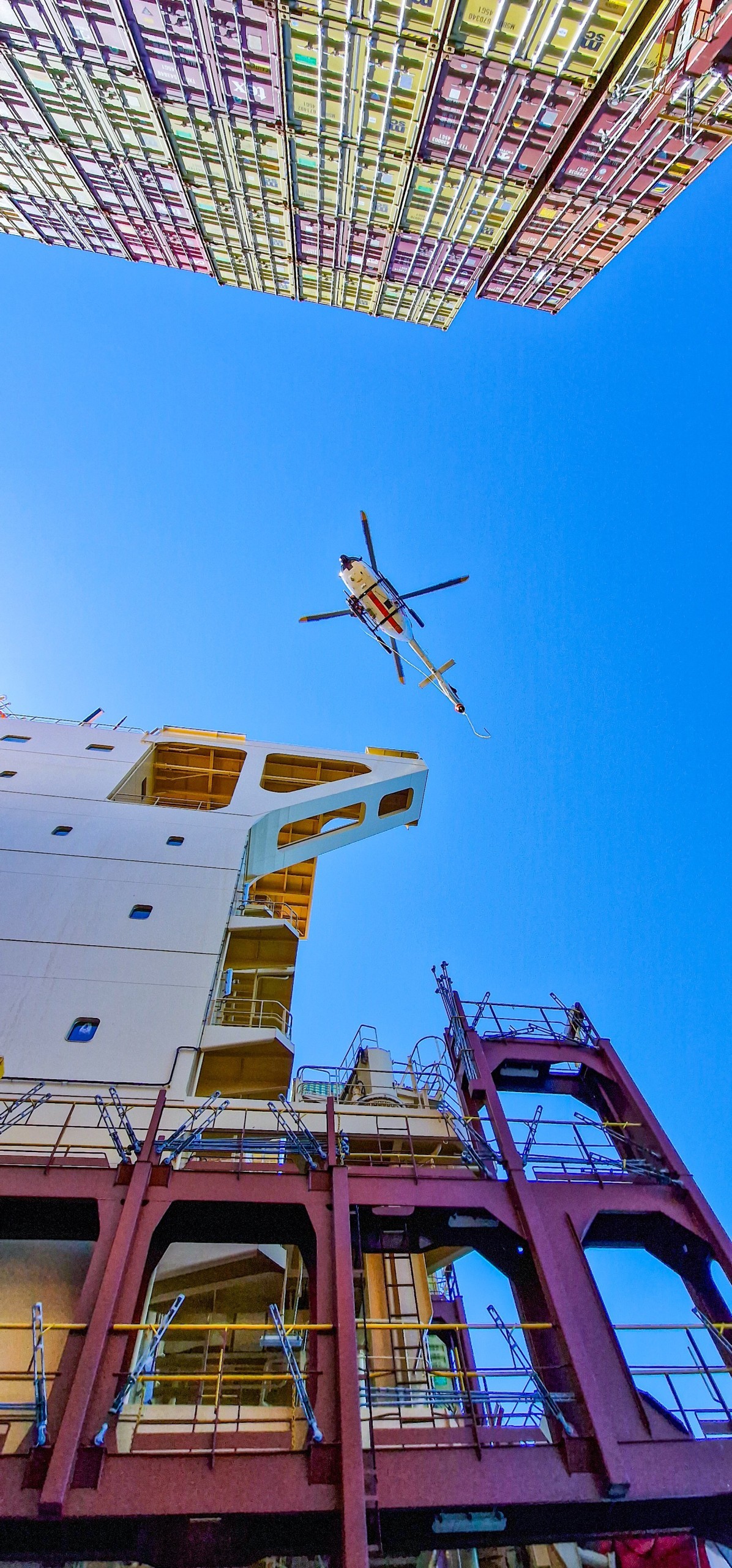 Hoist Training between the Containers on the MSC Container Ship in the Northsea