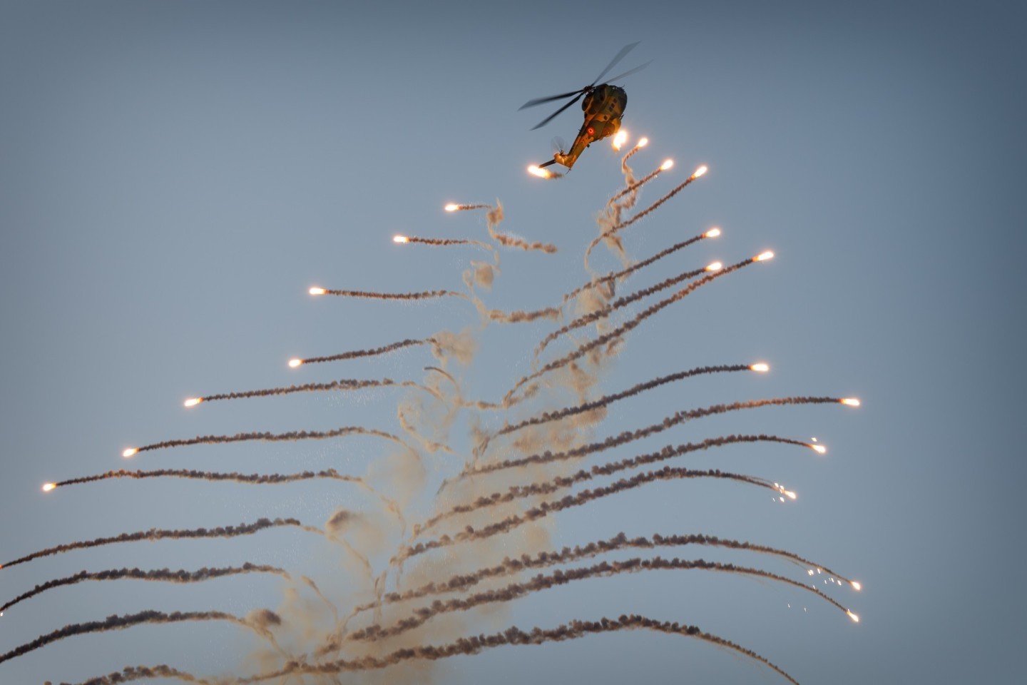 The end of Bucharest International Air Show was marked by the IAR-330 Puma solo display. At the end of the display two rounds of flares were launched, here looking like a Christmas tree of flares.