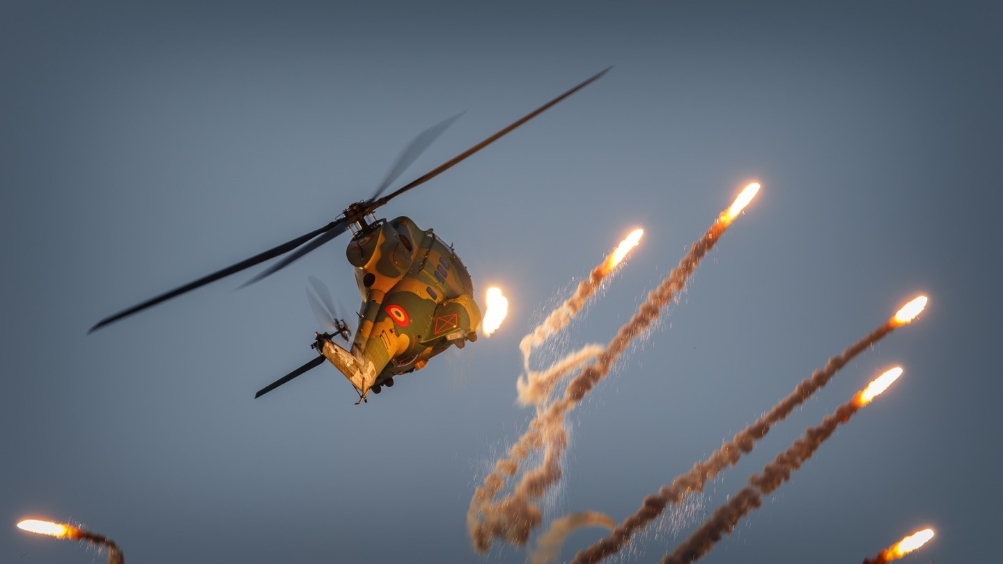 While launching its full load of flares it looked like a Christmas tree with the Puma on top of it. This is a close up of the top of the "flares tree". Sunset display of the IAR-330 Puma at the Bucharest International Air Show.