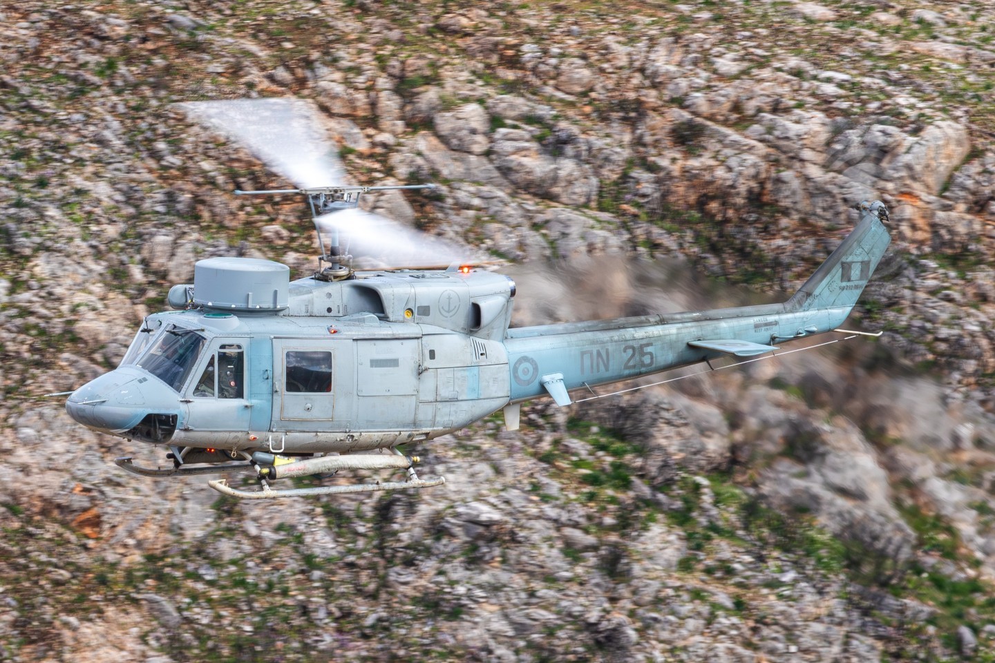 a Hellenic navy Agusta bell 412 during a low level sortie in the greek mountain side. A very rare occasion to see one of these helicopters in the wild.
