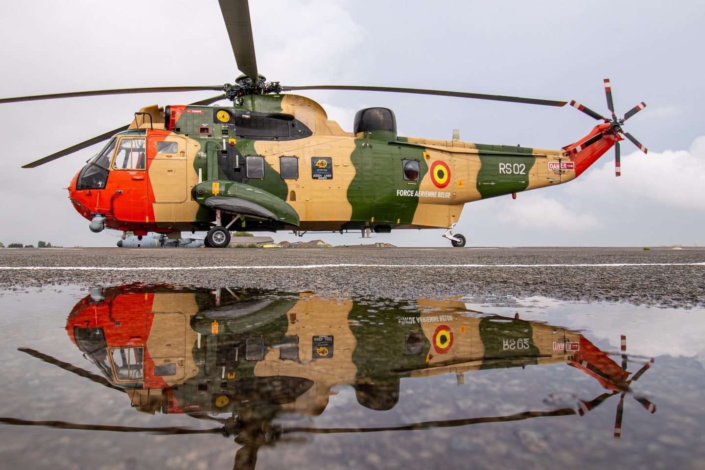 RS02, or as she is now registrered: G-BDNI. operated by the Historical helicopters group and seen here at her former base, Koksijde. After a heavy rain shower creating some nice puddles for reflections