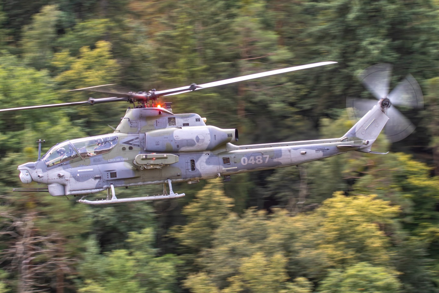 one of the new AH-1Z Vipers during a low level sortie in the Czech Republic. It showcases how much the camo blends in with their nature and it's environment.