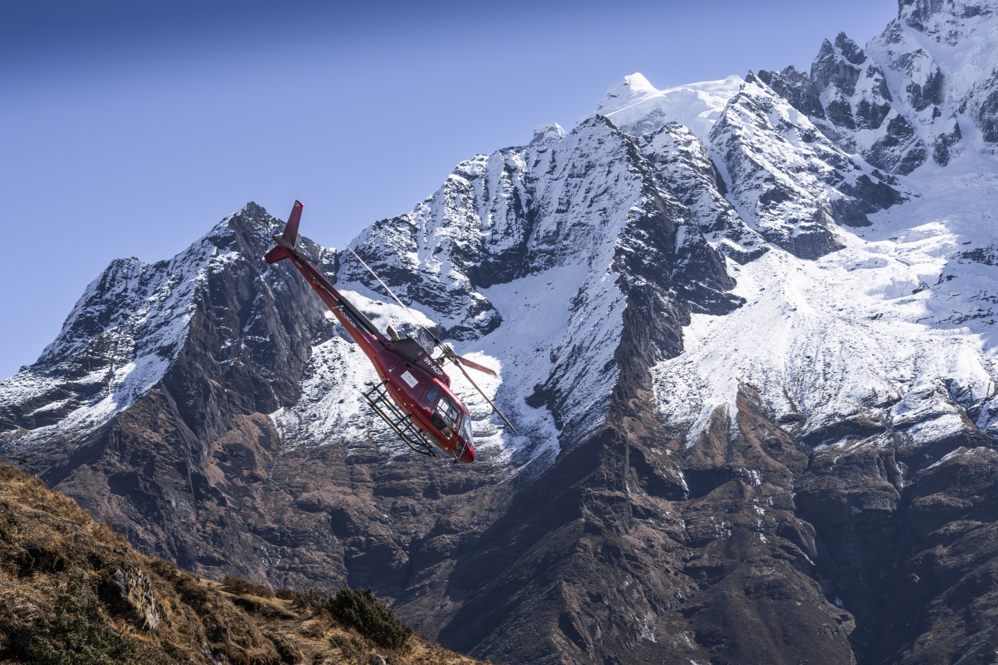 A B3 Helicopter departing from Hotel Everest View, situated at 12,730 ft, with passengers after a flight around the Sagarmatha National Park (Everest Region) of Nepal.