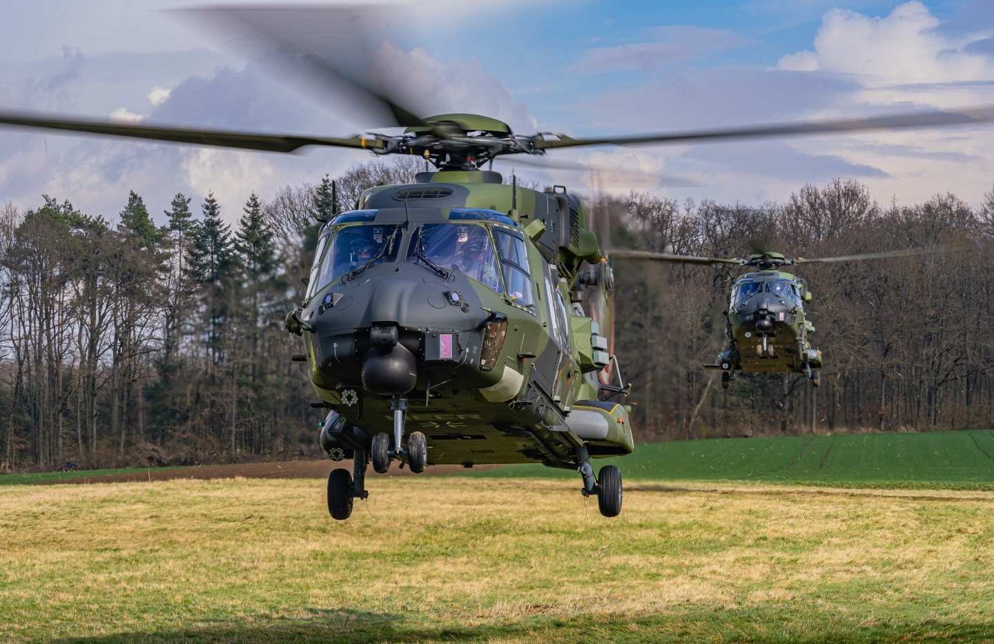 Nato Helicopter NH90 of the Bundeswehr during a training in Germany. The Helicopters are based at Niederstetten. It was a 4-Ship Formation. Here u can see 2 of the 4 Helicopters landing on a little grass strip.