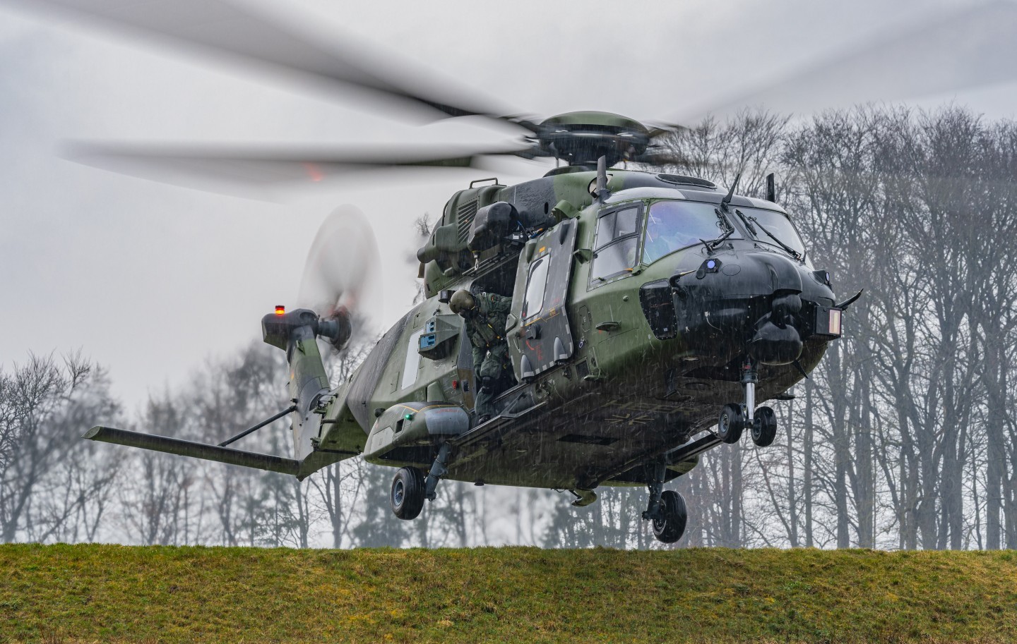 78+14 NH90 of the German Bundeswehr. The helicopter is based at Niederstetten Airfield. Here u can see it landing on a Dam during bad weather and heavy rain.