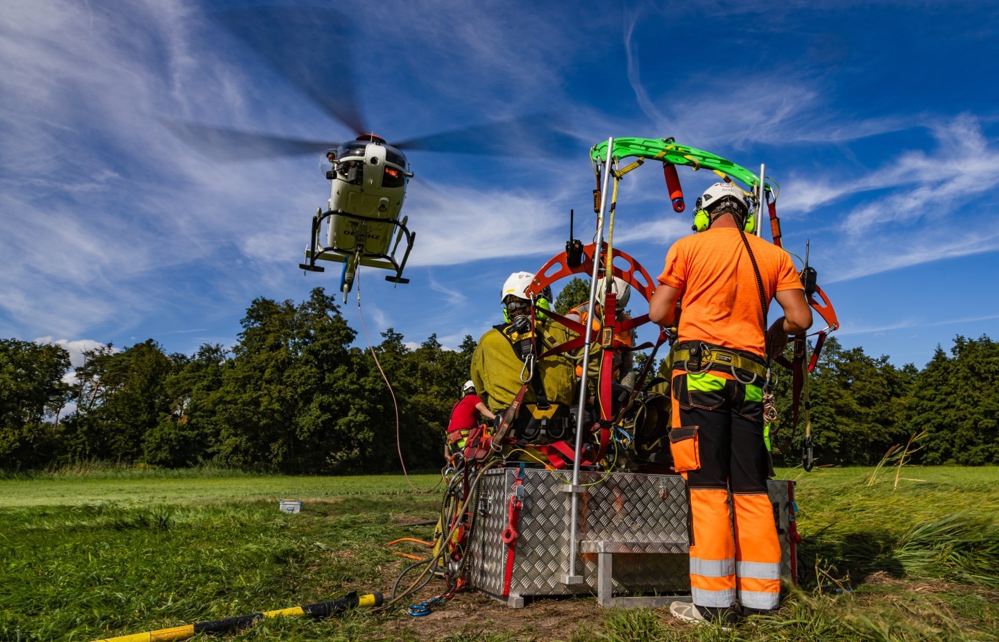 OE-XHZ Airbus EC135 helicopter of the austrian company Wucher. Here you can see the Helicopter landing. They build a new Powerline. The chair is hanging under the Helicopter to bring the workers to the Powerline