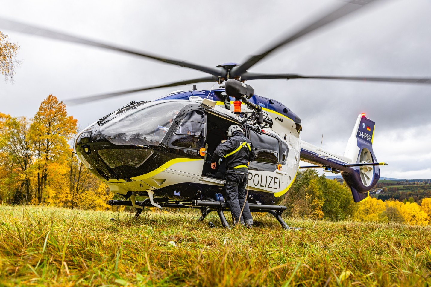 D-HPBF, Airbus H145D3 of the bavarian Police during an exercise of the Bergwacht Bayern. U can see the helicopter standing on a little grass strip in beautiful autumn light