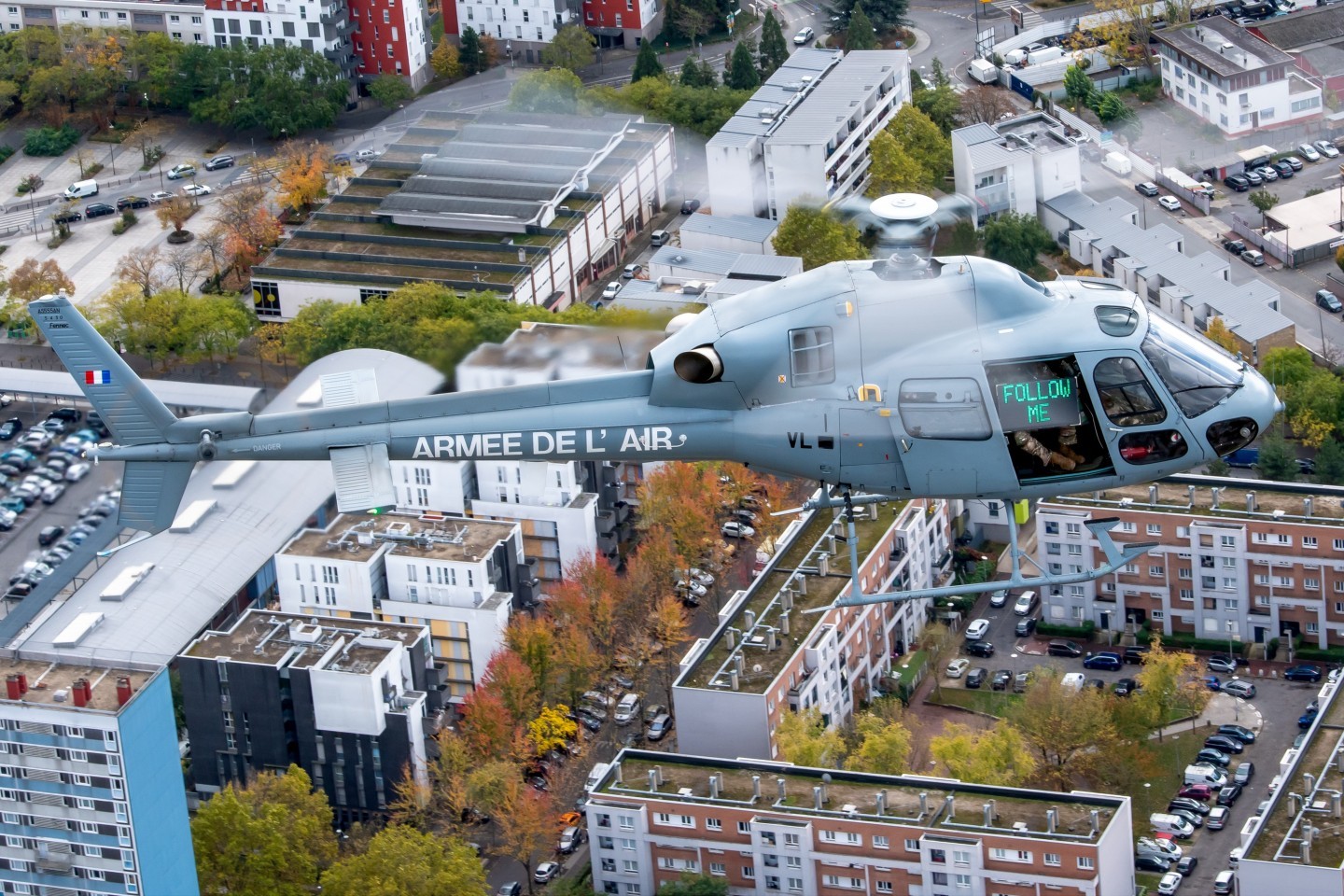 I took this picture of the AS555AN Fennec helicopter of the EH03.067 "Parisis" during a MASA / Air Security mission over Paris. In the background, you can see the commandos holding the "FOLLOW ME" sign. They use this to contact other aircraft if radio communication is unsuccessful.
