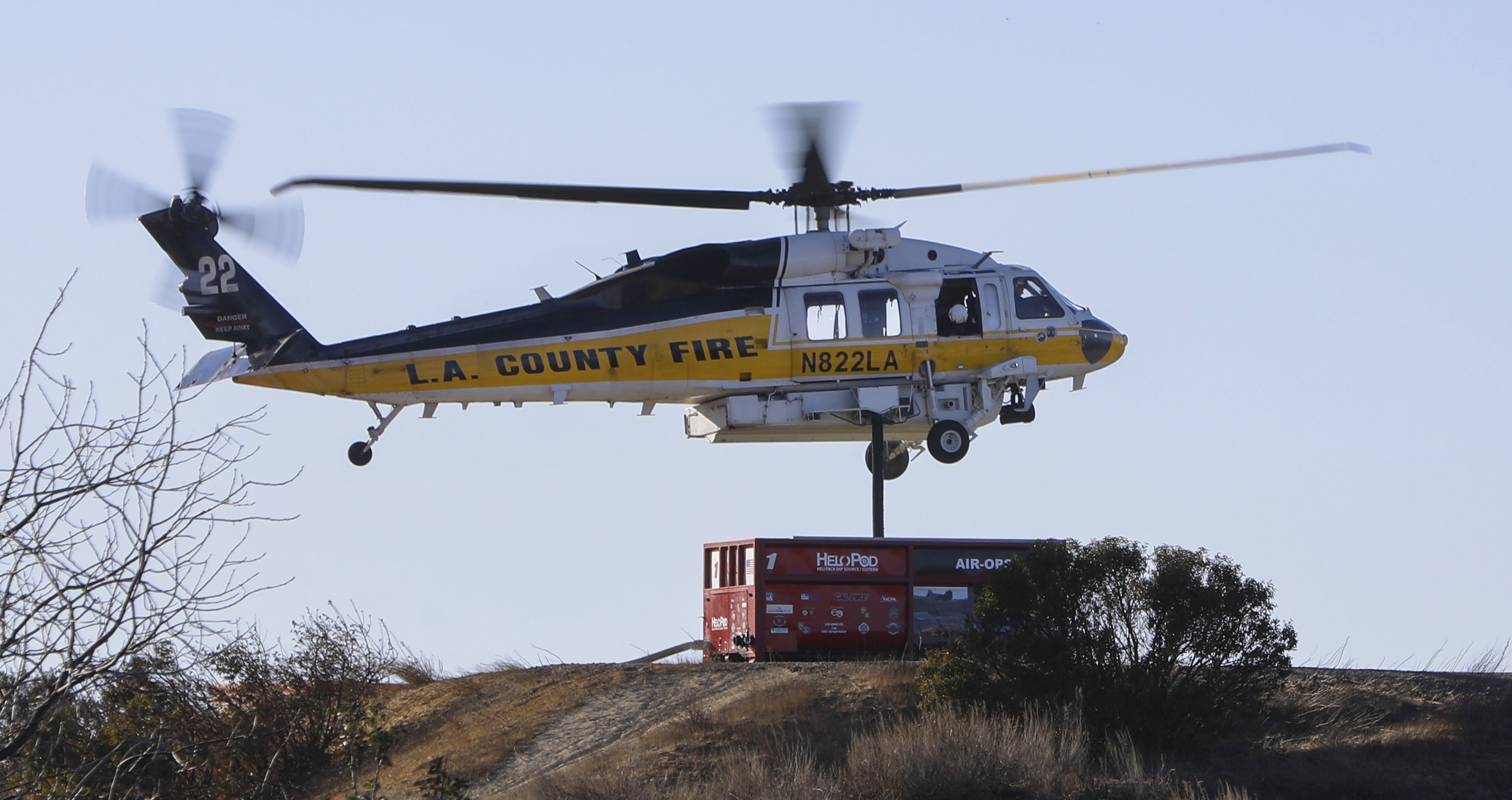 LA County Fire Dept/ Copter 22, filling up with water utilizing a mobile water tank and making numerous trips to and from the Palisades Fire during the January 2025 Los Angeles Firestorm.