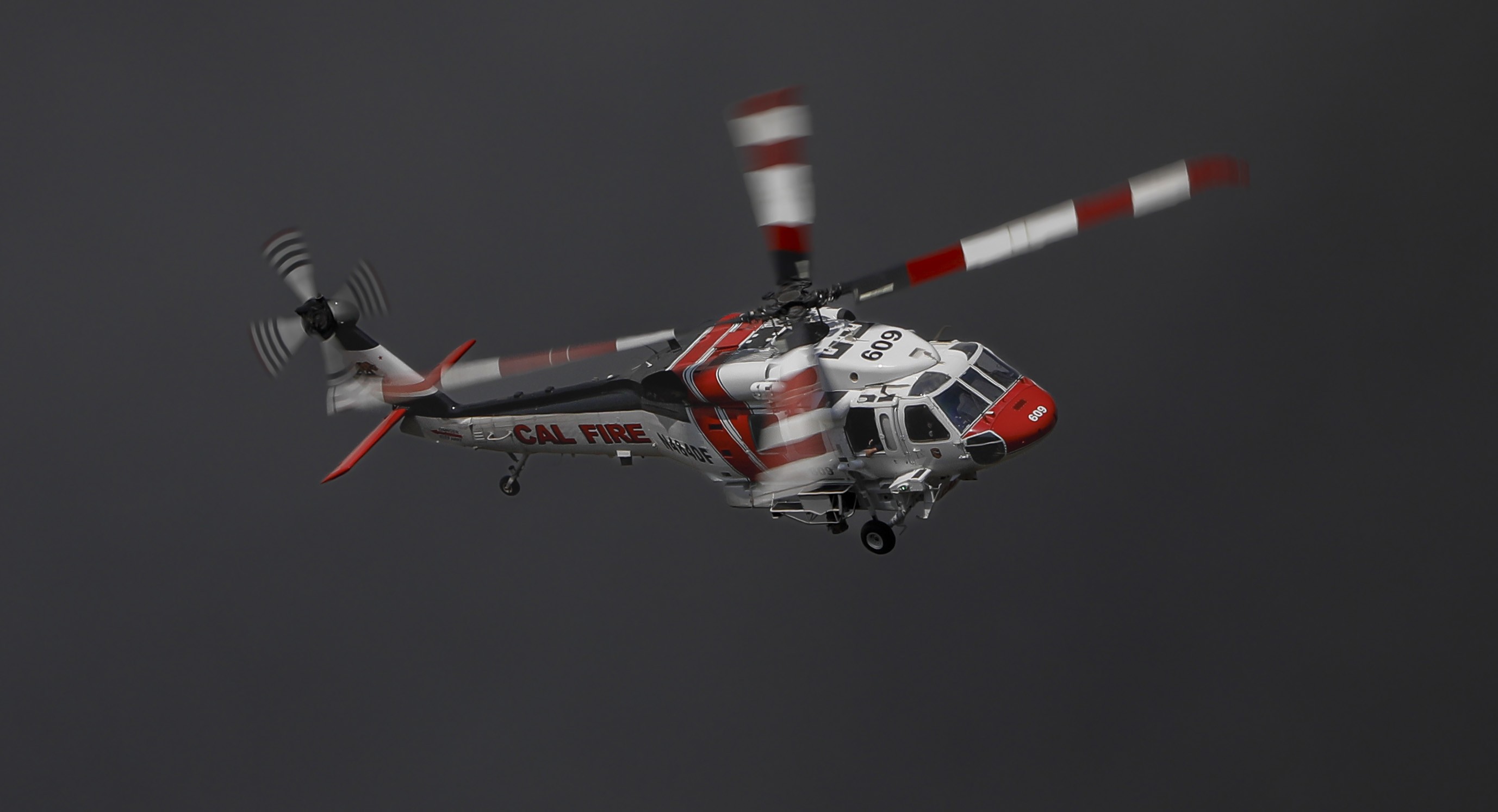 CAL FIRE copter 609, a Sikorsky S-70i Firehawk based out of Hemet-Ryan air attack base in Riverside County, CA passing over following a drop on the Dale Fire.