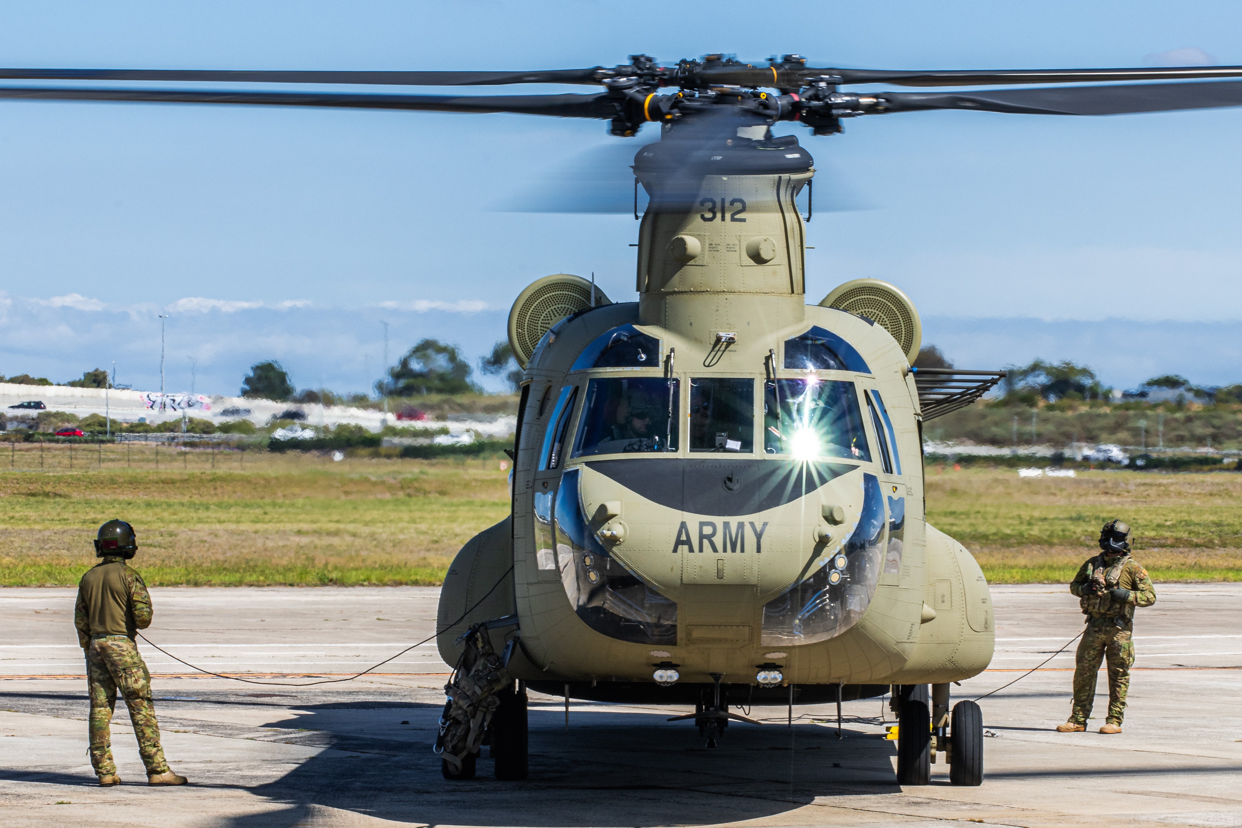 Australian Army Aviation Loadmasters on the ground for a flight of two Chinooks "Chainsaw" arriving in Melbourne for Avalon Australian International Airshow 2025.