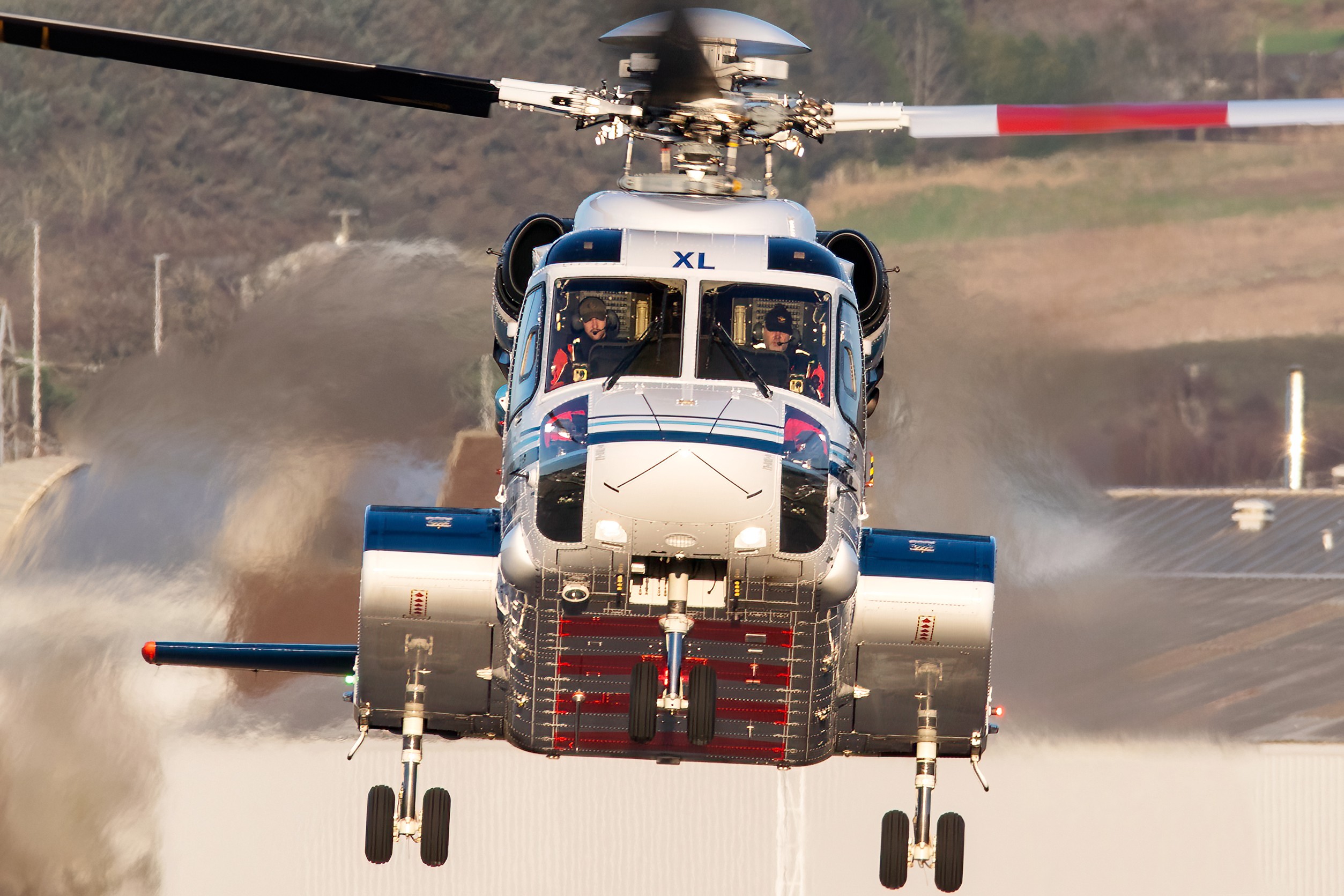 The sun perfectly illuminates the cockpit of this Sikorsky S92 arriving back at Aberdeen after an offshore flight.