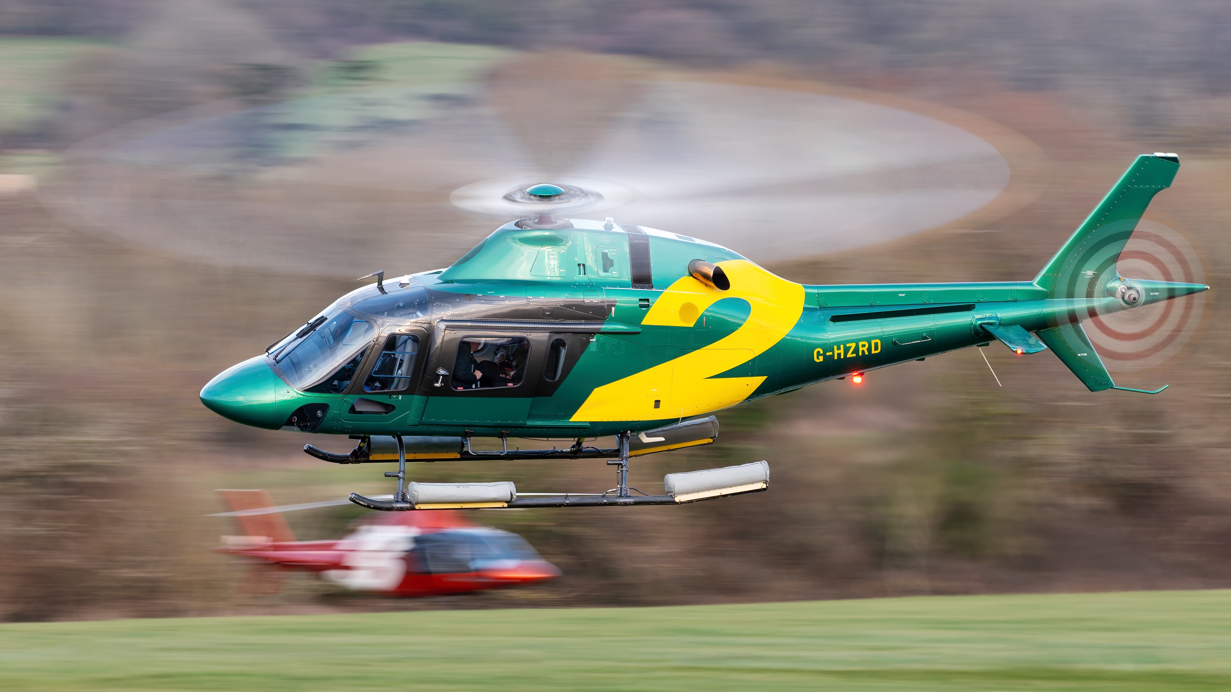 A corporate AW119 makes a slight turn on departure out of a very busy heliport at the Cheltenham Festival 2025, allowing some excellent panning practice.