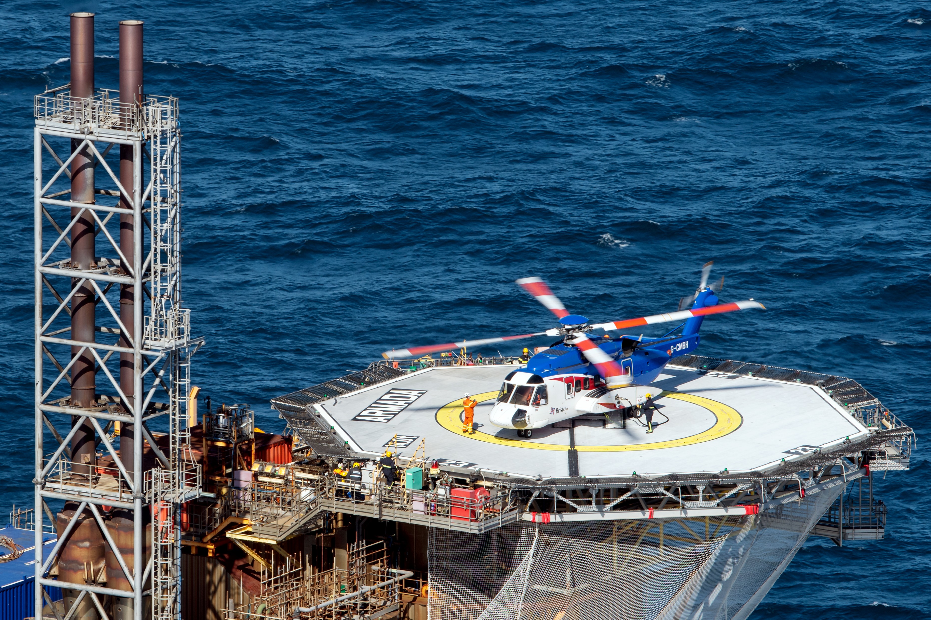 A Sikorsky S92 is rotors running on an offshore platform in the North Sea during a regular crew change flight. For many, this is just a regular commute to work.