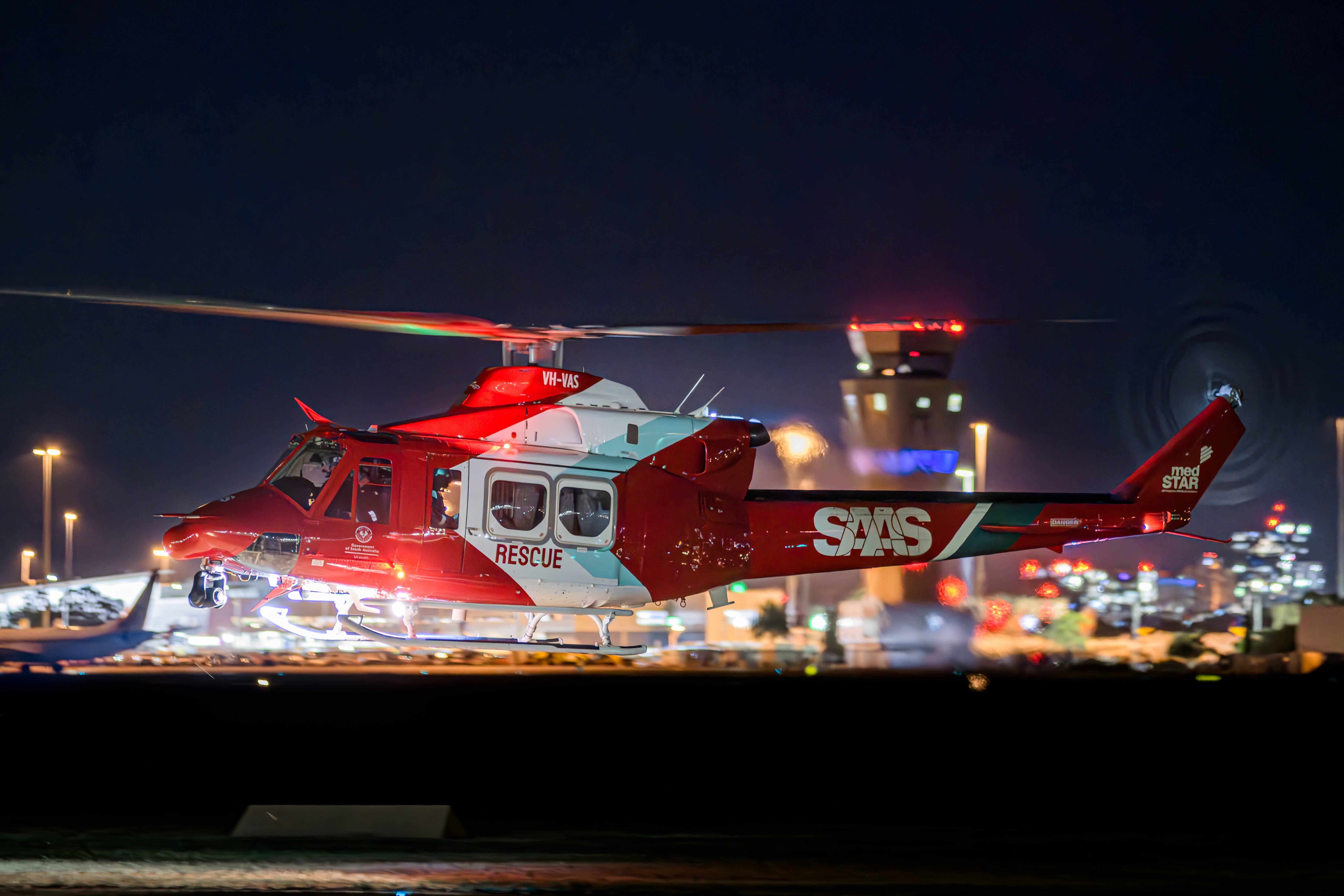 South Australia Ambulance Service Bell 412 VH-VAS 'RESCUE 51' landing after conducting night winching operations in the Christmas Hill Forest Reserve.