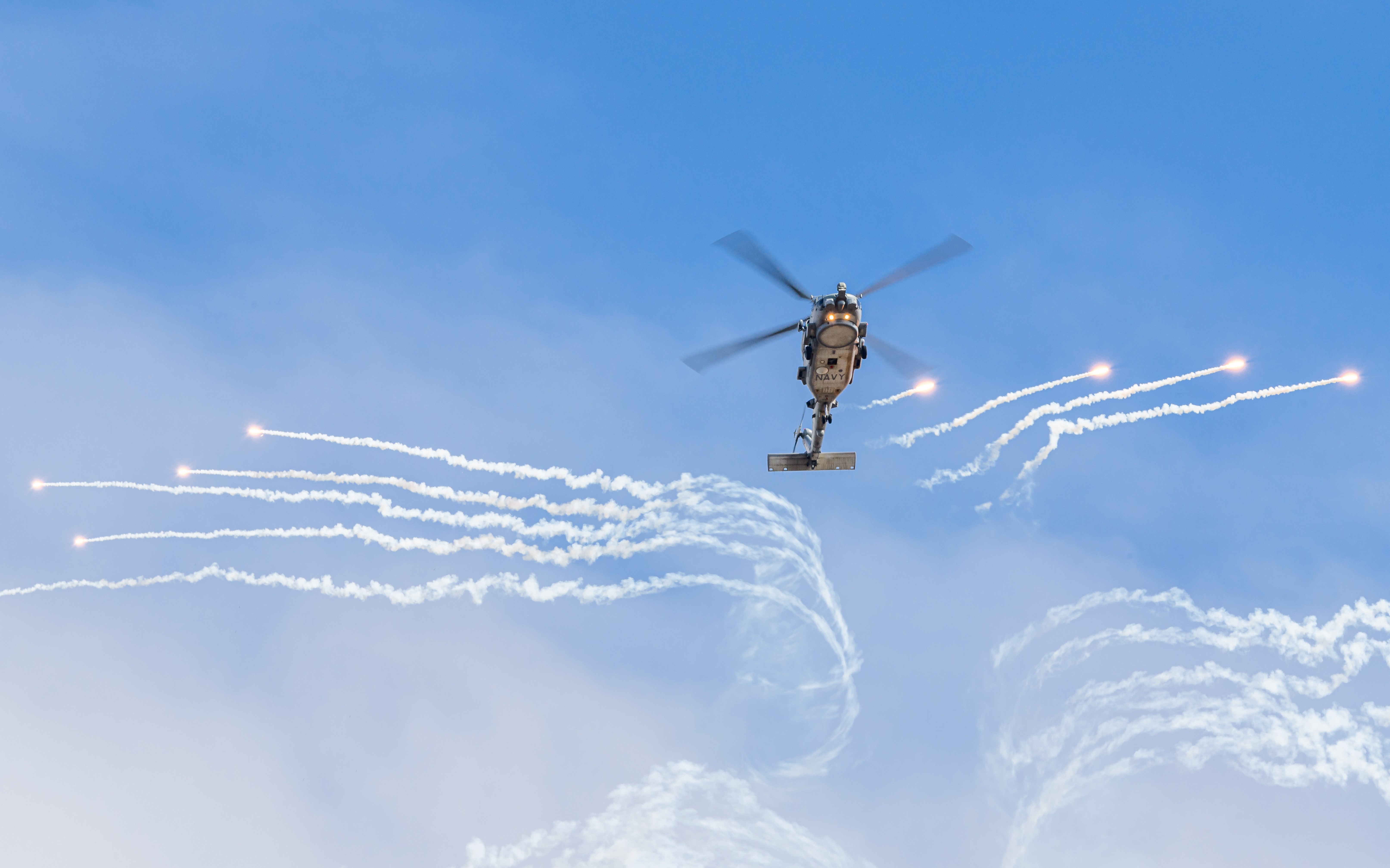 Royal Australian Navy MH-60R Seahawk N48-011  as  'GAUNTLET 11' deploys flares during a flying display at the Avalon Australian International Airshow.