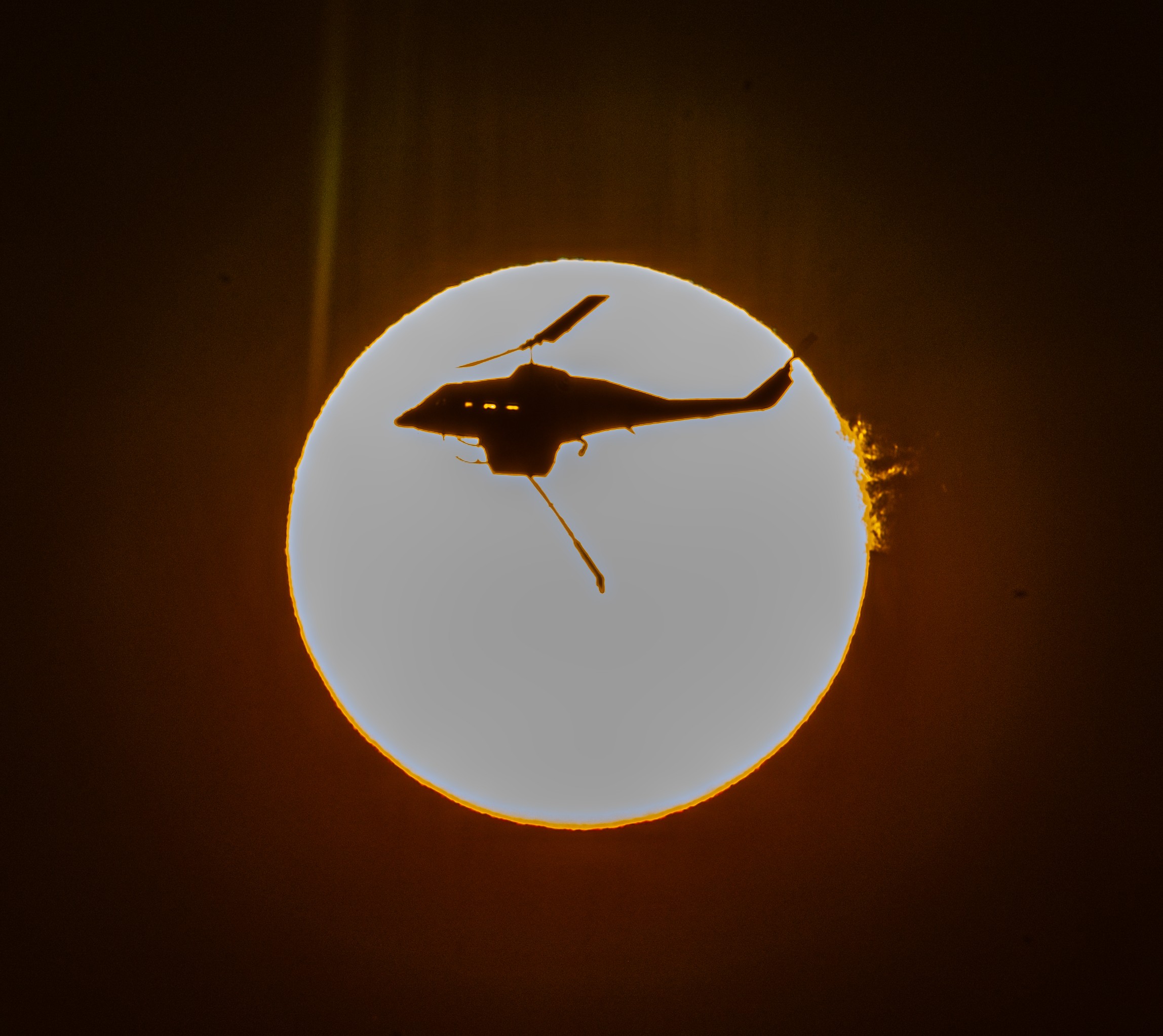 McDermott Aviation Bell 214ST N746H crossing the sun ,getting ready for the next water bomb late in the afternoon on  a big fire near Athens along with almost every aviable heli that Greece had this summer