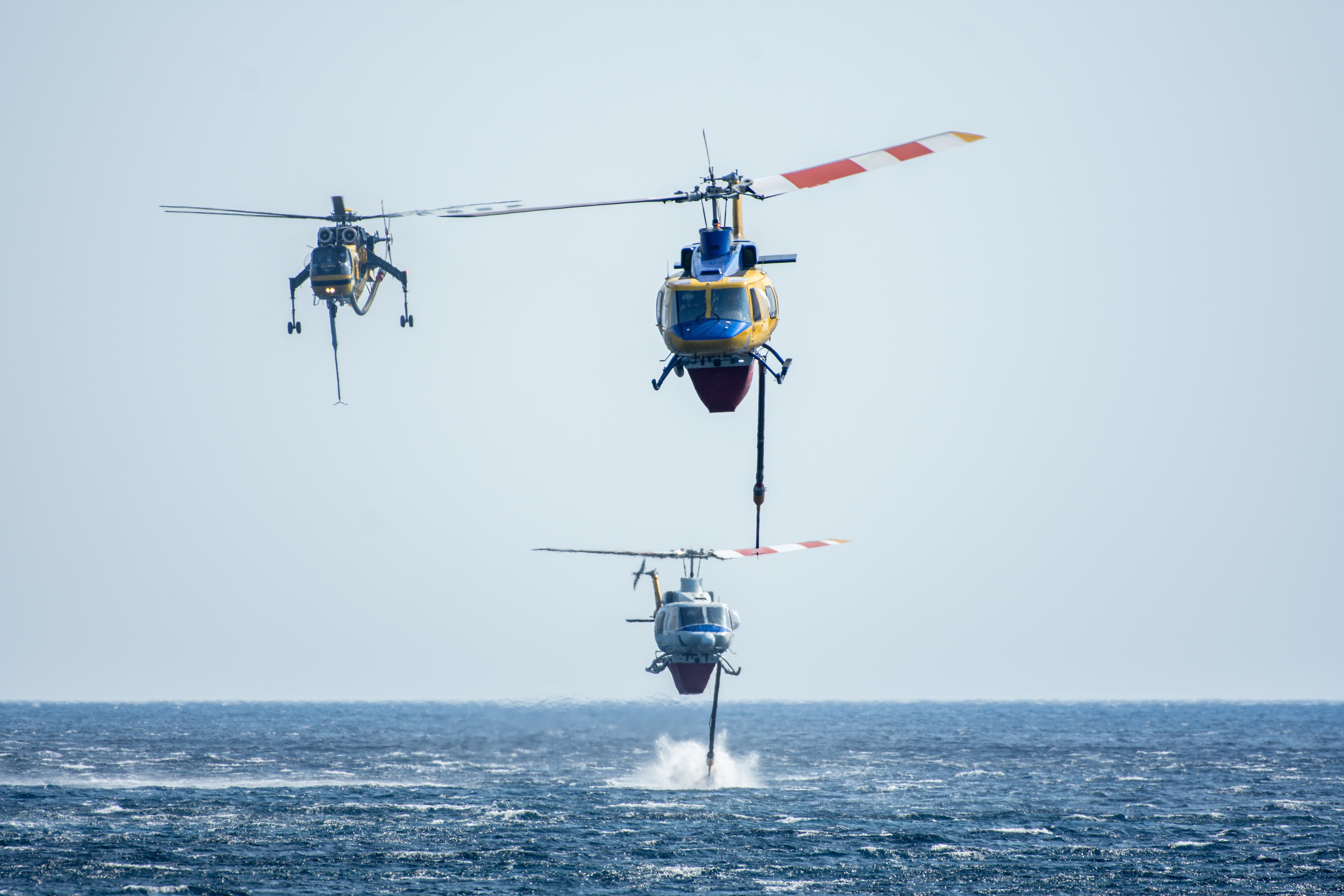 McDermott Aviation Bell 214ST N725HT, Bell 214ST N746H, and Helicopter Express S64E N243AC working together as a team and getting ready for the next waterdrop.