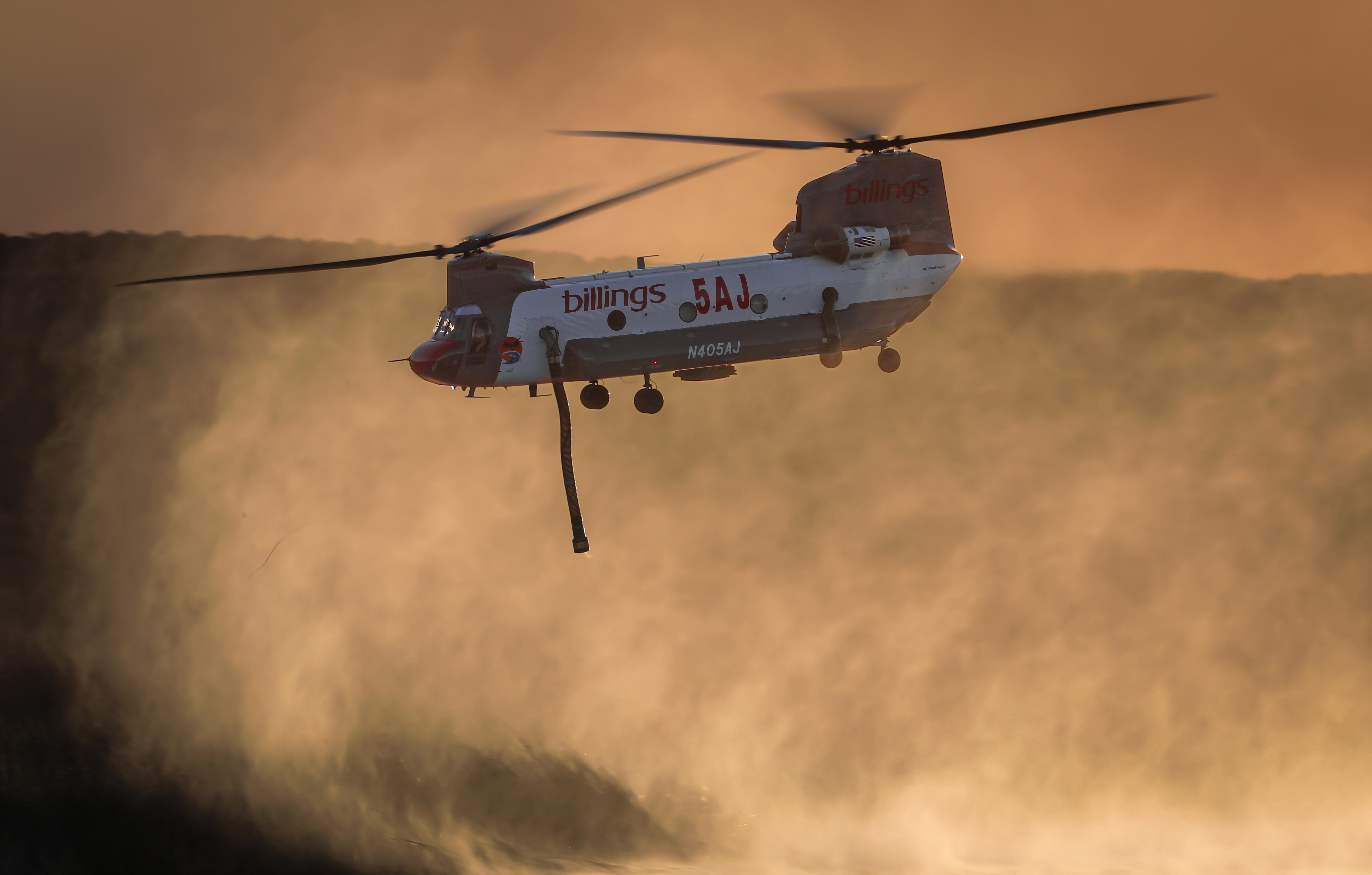 Billings helitanker 4AJ operating as a private contractor assigned to San Diego County during the Border 2 Fire in the Otay Mountains, departs the Otay Lakes dip in Chula Vista, CA.