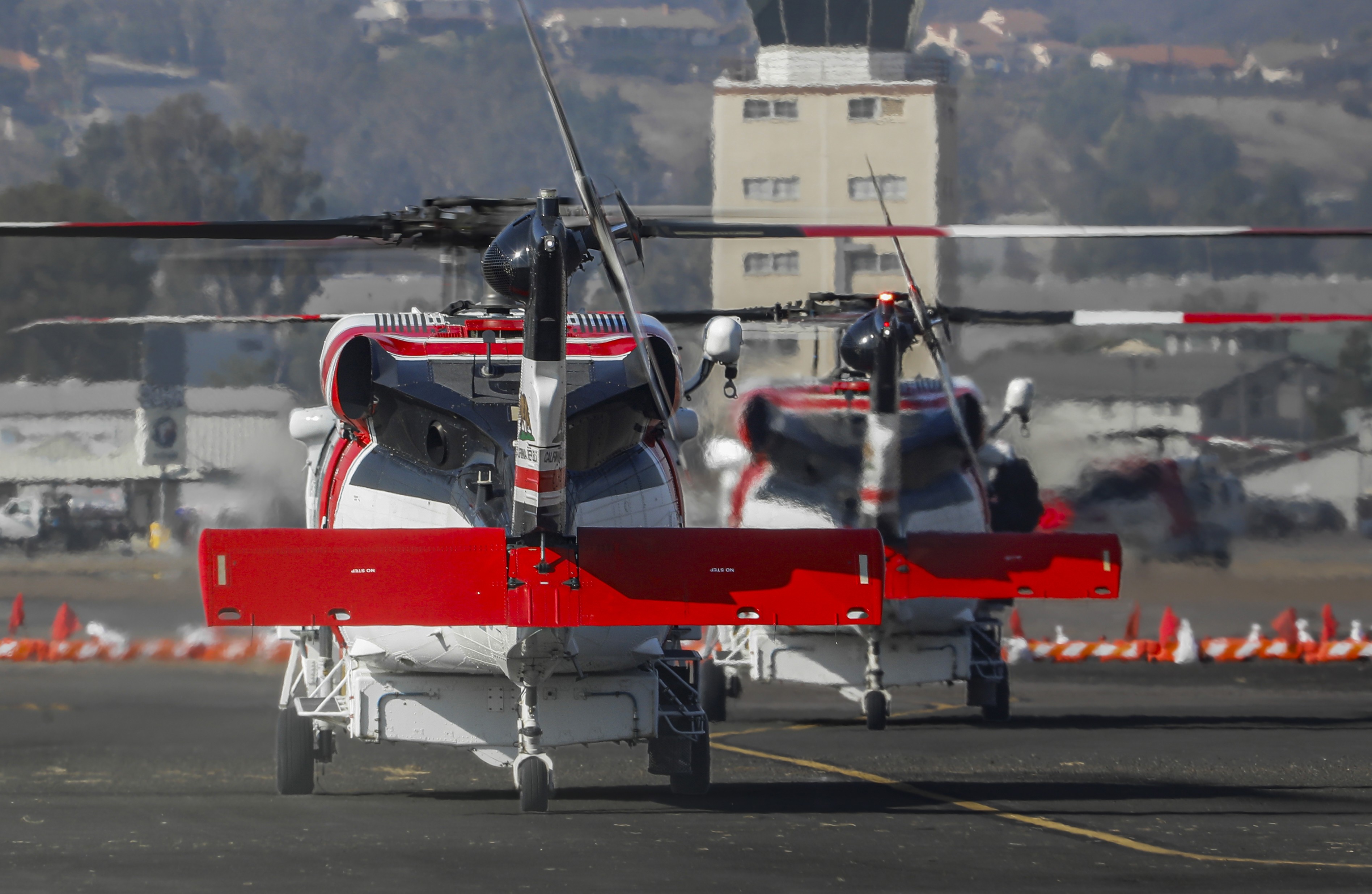 CAL FIRE Copters 602, 605, and 613 hot on the deck at the temporary helibase at the Gillespie airport in El Cajon, CA during the Border 2 Fire in the Otay Mountains.