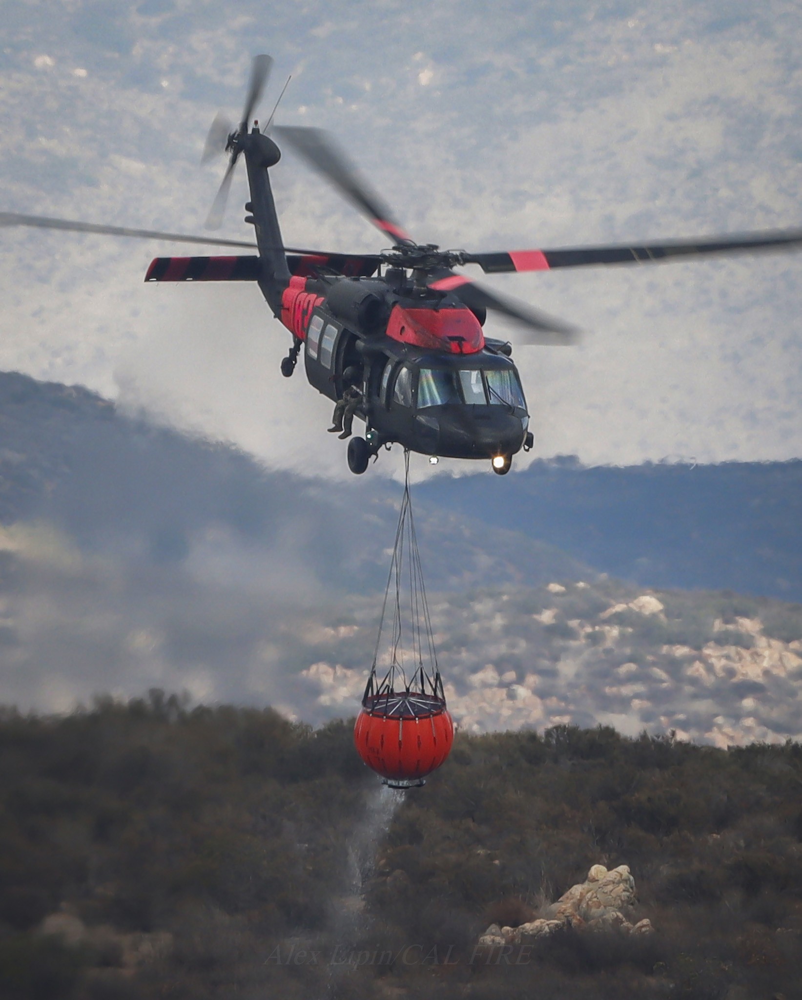 GUARD Copter 836 assigned to San Diego County during the Border 2 Fire in the Otay Mountain Wilderness area, making a quick getaway after dipping in the Otay Lakes of Chula Vista, CA