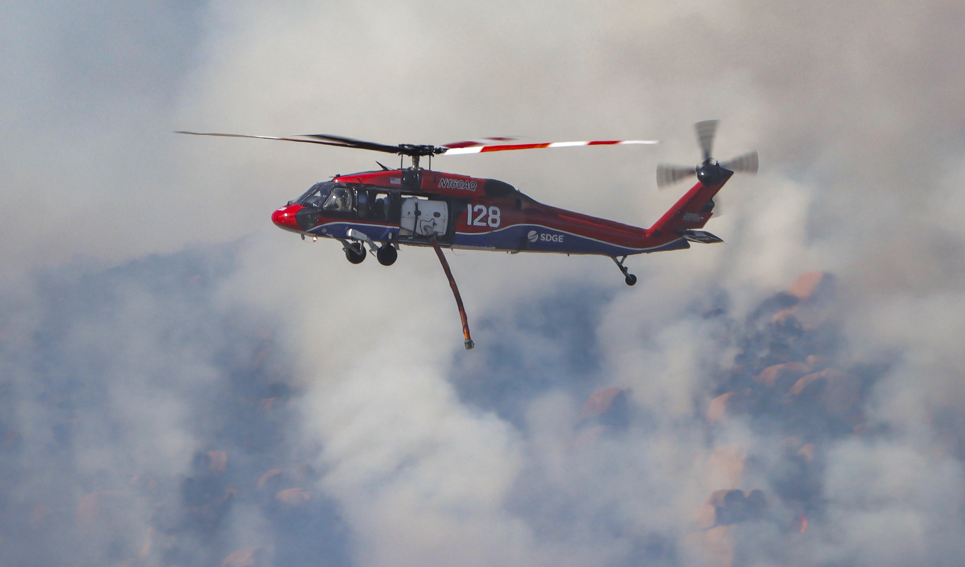Copter 128, passing by as they approach the dip sight while supporting other firefighting agencies on containing a large vegetation fire in Lakeside, CA dubbed the Monte Fire.