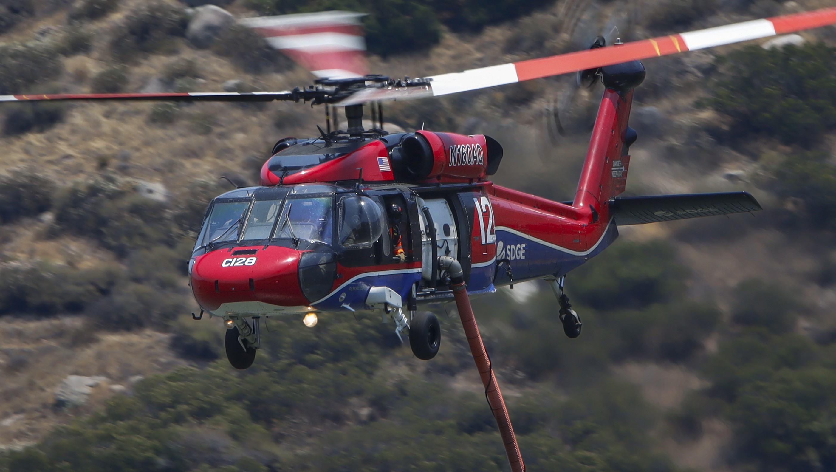 Copter 128 departs the El Capitan dip while supporting other firefighting agencies on containing a large vegetation fire in Lakeside, CA dubbed the Monte Fire.